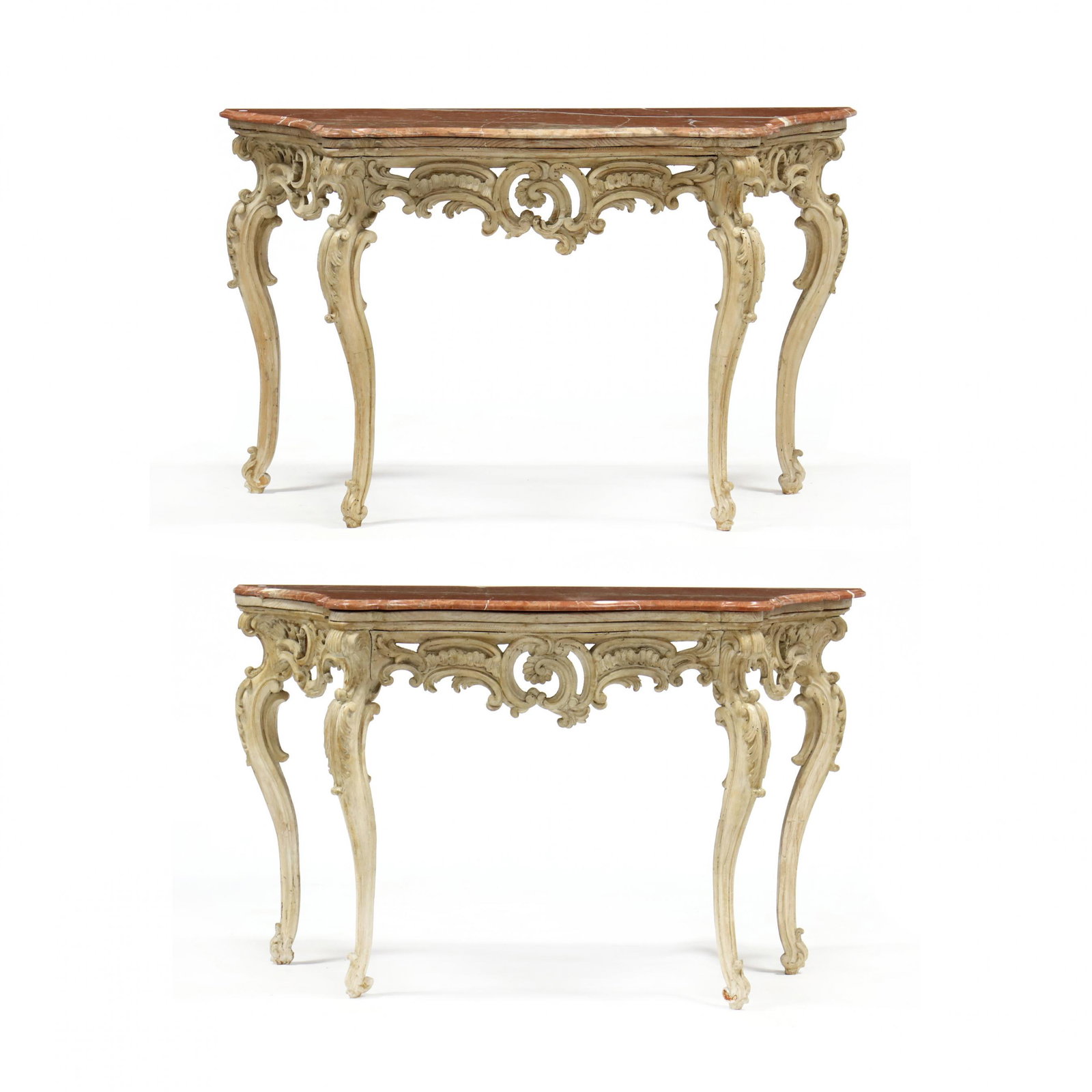 Pair of Continental Rococo Style Marble Top Console: Pair of Continental Rococo Style Marble Top Console Tables early 20th century, salmon tone, shaped and molded marble top, pierced and asymmetrical relief carved skirt, raised on four cabriole legs wit