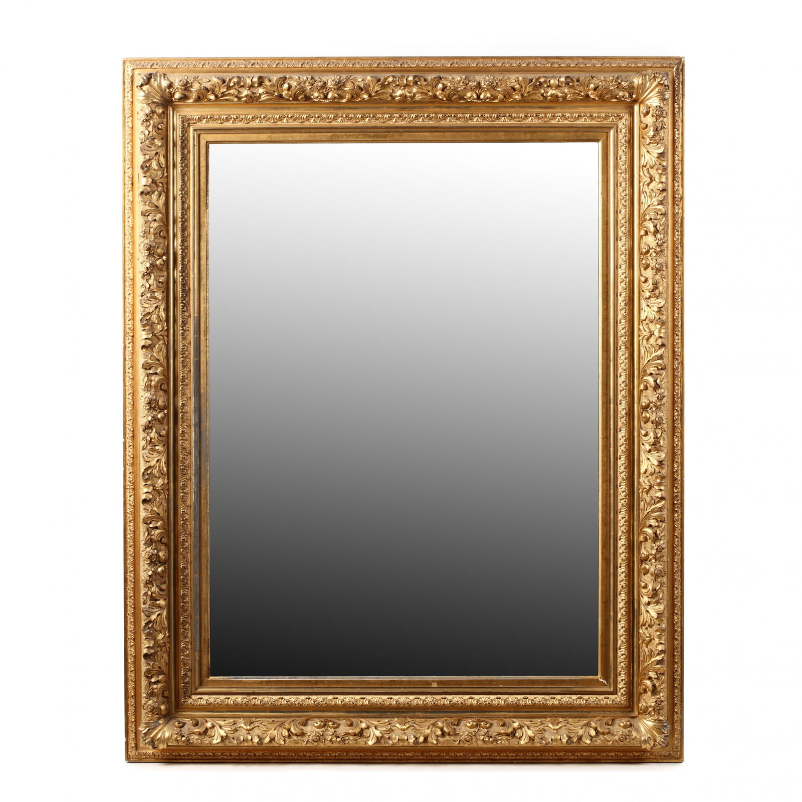 Large Antique Carved and Gilt Framed Mirror: Large Antique Carved and Gilt Framed Mirror 19th century, carved wood and composition with an antiqued glass mirror. 51 x 41 in. From the estate of the late Mary L. Hill, Chapel Hill, North Carolina A