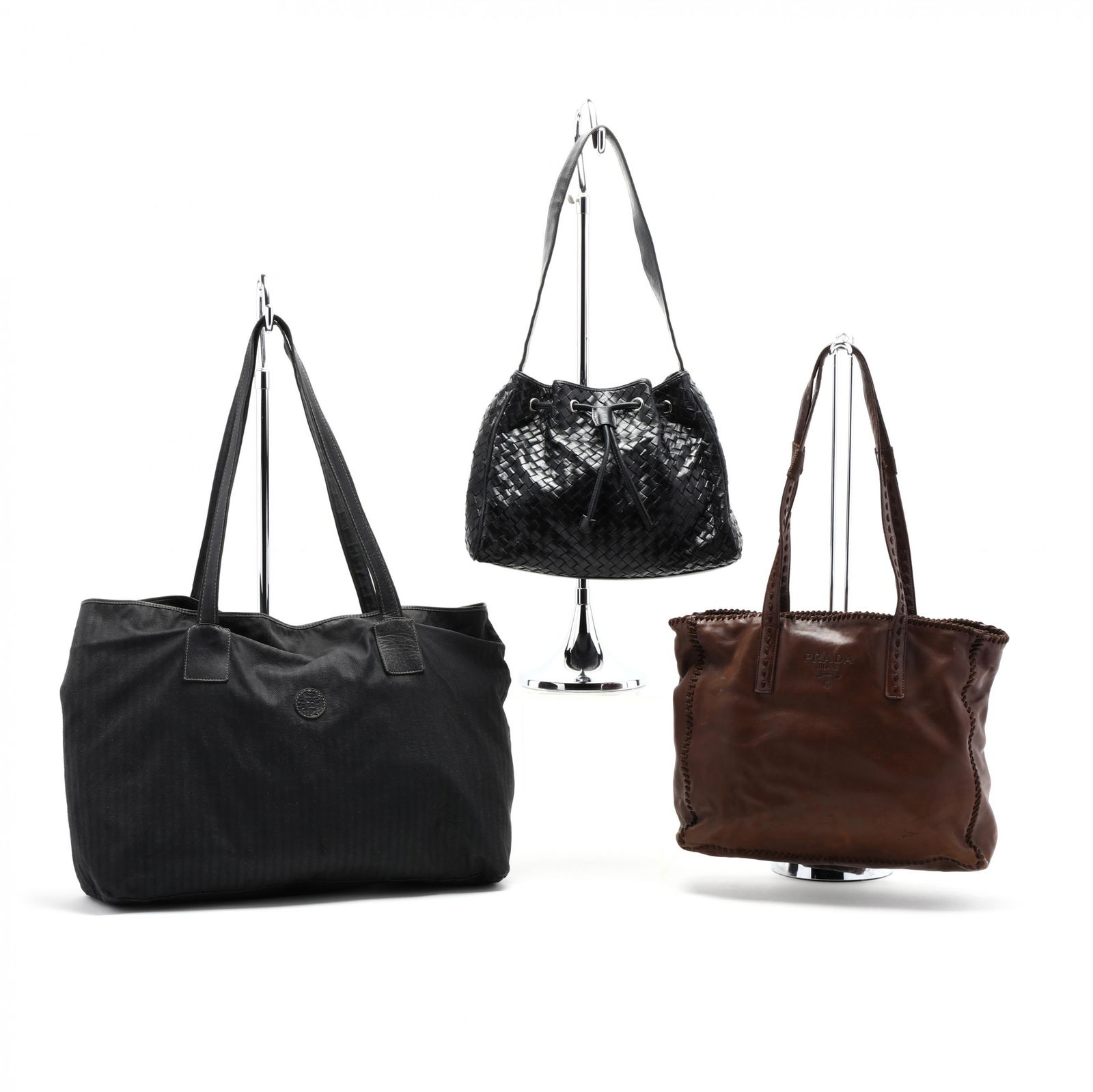 Three Vintage Fashion Handbags: Three Vintage Fashion Handbagsthe first is a drawstring small bucket bag, composed of woven black leather in the style of Bottega Veneta, fabric lined with a leather patch "Bloomingdale's" (very good