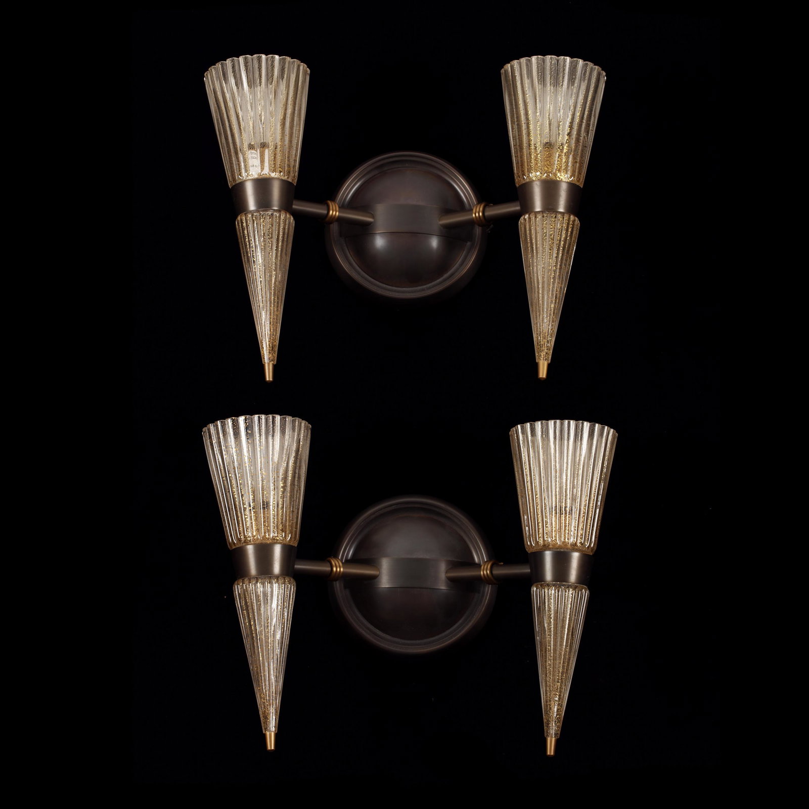 AndrÃ© Arbus (1903-1969), Pair of Murano Sconces for: AndrÃ© Arbus (1903-1969), Pair of Murano Sconces for Baker late 20th century, Italy, gold flecked glass tapered covers with brushed bronze mounts, labeled Made in Italy. 13 x 16 x 6.5 in. Curated se