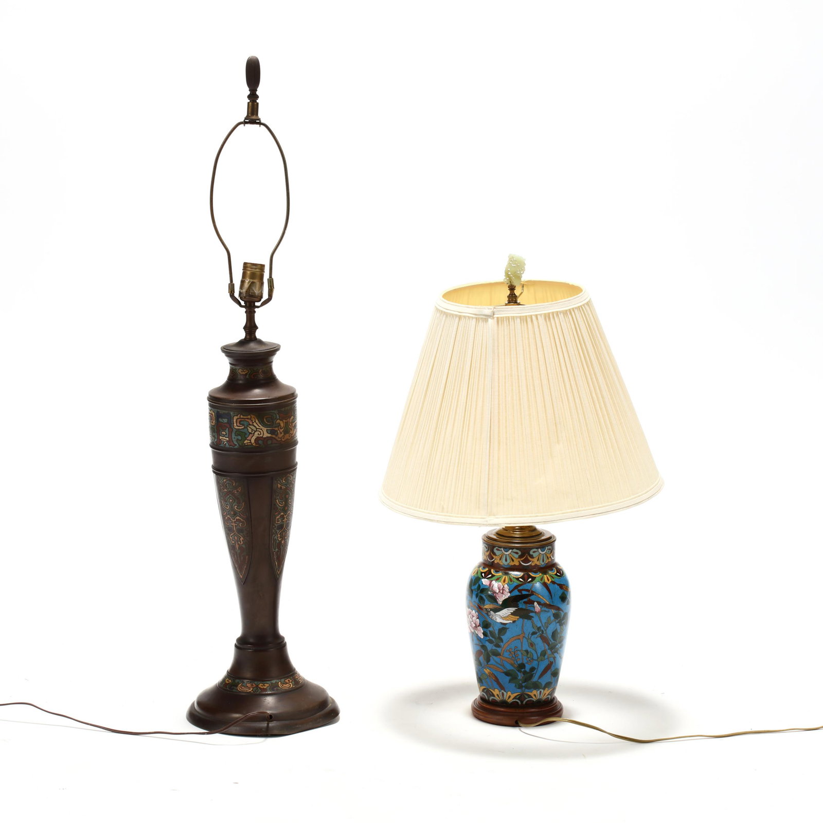 Two Vintage Asian Enameled Lamps: Two Vintage Asian Enameled Lampsearly 20th century, the taller a champleve lamp with mask design raised panels; the second a cloisonne lamp with bird and floral decoration. HOA 38 in. (Tallest) Estate