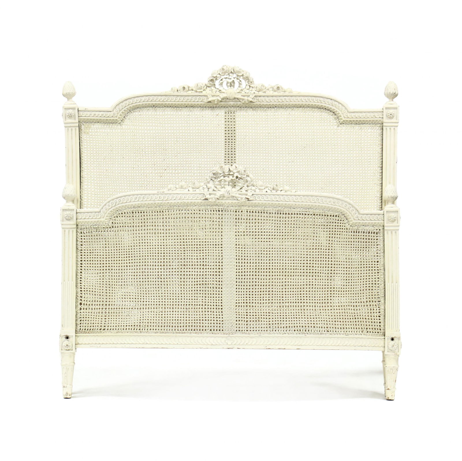 Louis XVI Style Full Size Carved and Painted Bed: Louis XVI Style Full Size Carved and Painted Bedearly 20th century, later white paint, relief carved headboard featuring central floral and ribbon pediment over cane panel with artichoke finials and s