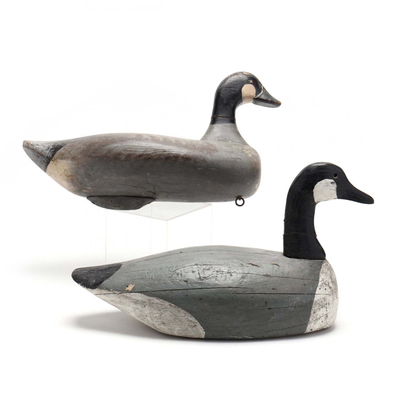 Two Vintage Carved Canada Goose Working Decoys: Two Vintage Carved Canada Goose Working Decoys solid carved and painted wood, one with a relief carved bill and with lead weight. Longer 22 in. Private Collection, Charlotte, North Carolina Additional