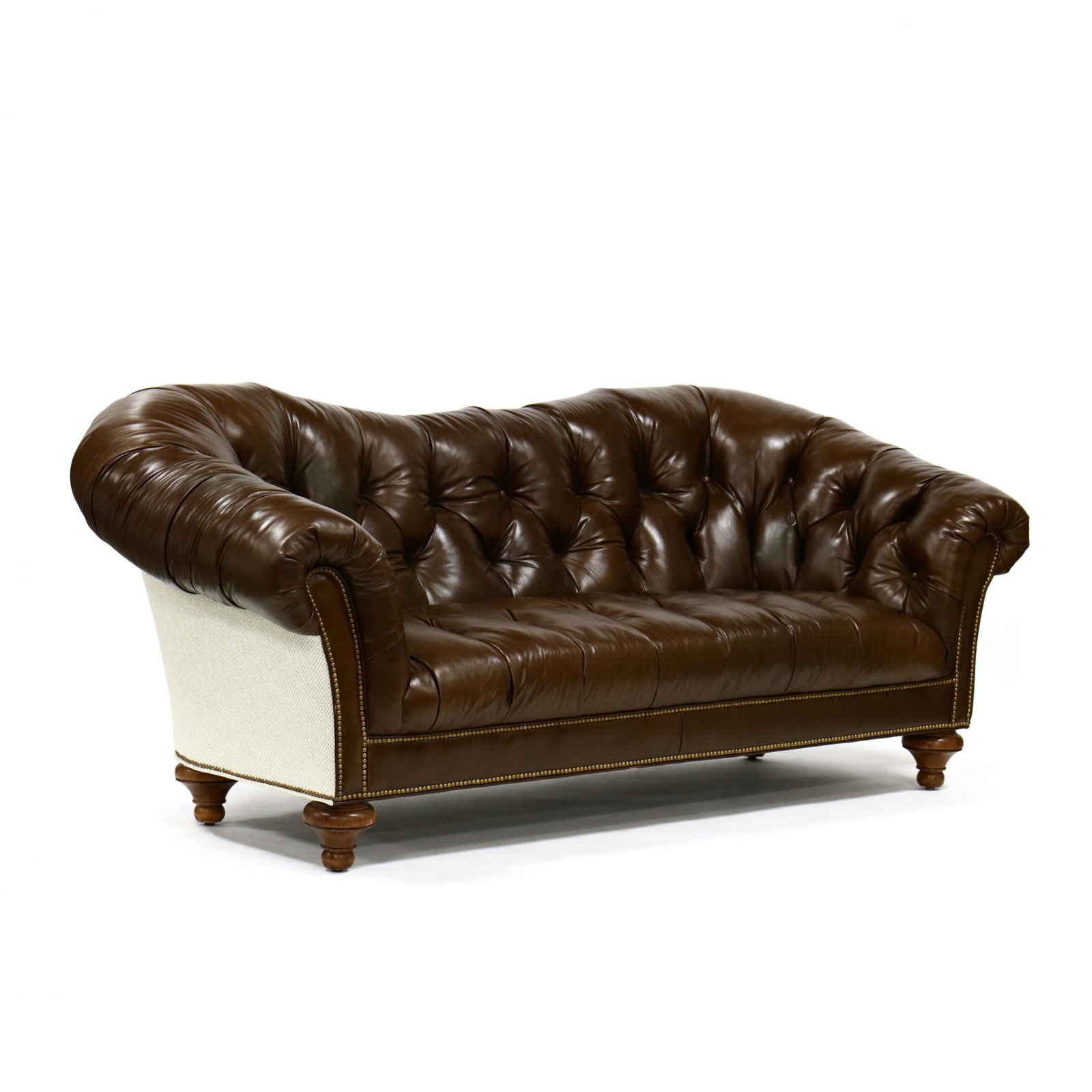 Contemporary Tufted Leather Sofa: Contemporary Tufted Leather Sofa late 20th century, tufted brown leather back and seat, with brass nailhead trim, alternating woven upholstered back, on turned wood feet. 38 x 93 x 33 in. From the col