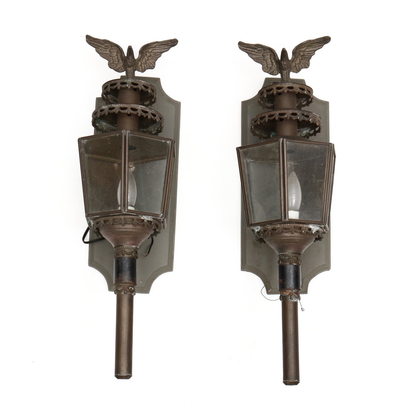 Pair of Federal Style Brass Wall Sconces: Pair of Federal Style Brass Wall Sconces second half 20th century, single light form, eagle finials, glass panel lantern mounted to a painted wood wall plate, labeled W. F. Harris. 27 x 8 x 10 in. Pri