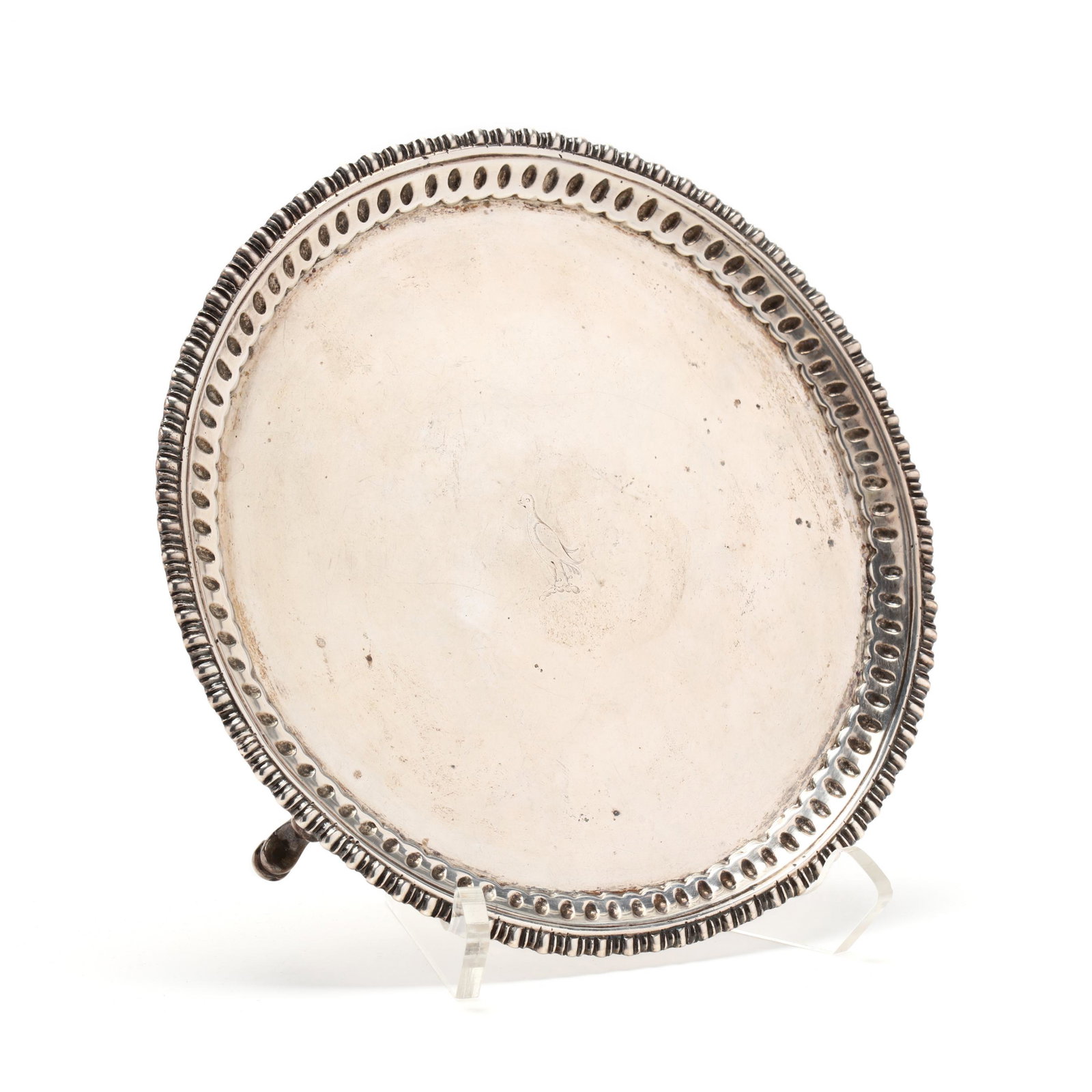 An S. Kirk & Son Coin Silver Salver: An S. Kirk & Son Coin Silver Salver circa 1850, circular form with decorative border and raised on three modified hoof feet, the well with period armorial engraving. 1 x 8 in. diameter 14.75 troy oz. 