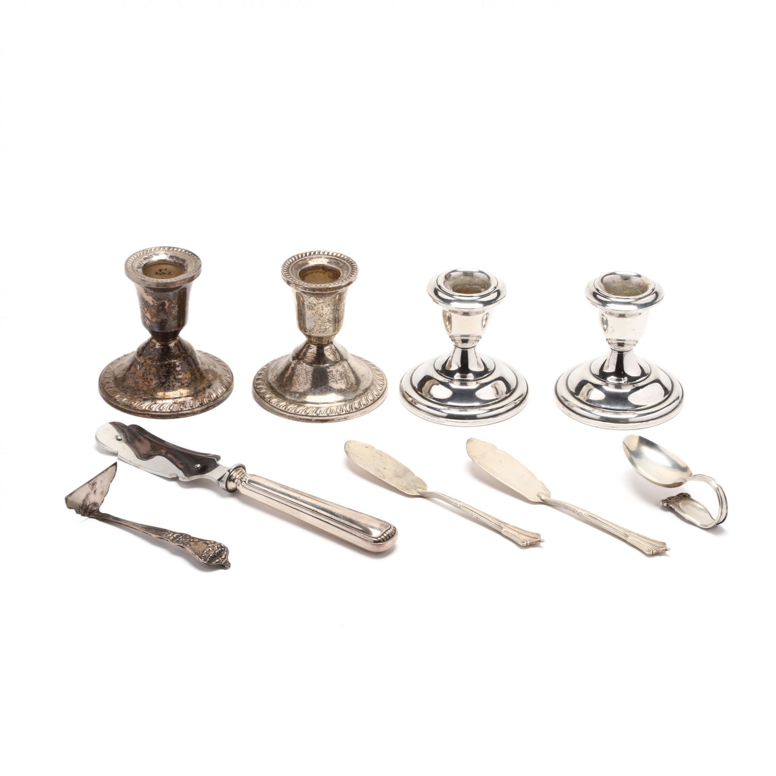 Sterling Silver Flatware and Candlesticks: Sterling Silver Flatware and Candlesticksincluding (2) pairs of low candlesticks, no monograms (minor denting); a pair of Victorian silver butter knives with mark of William Gibson & John Lawrence Lan