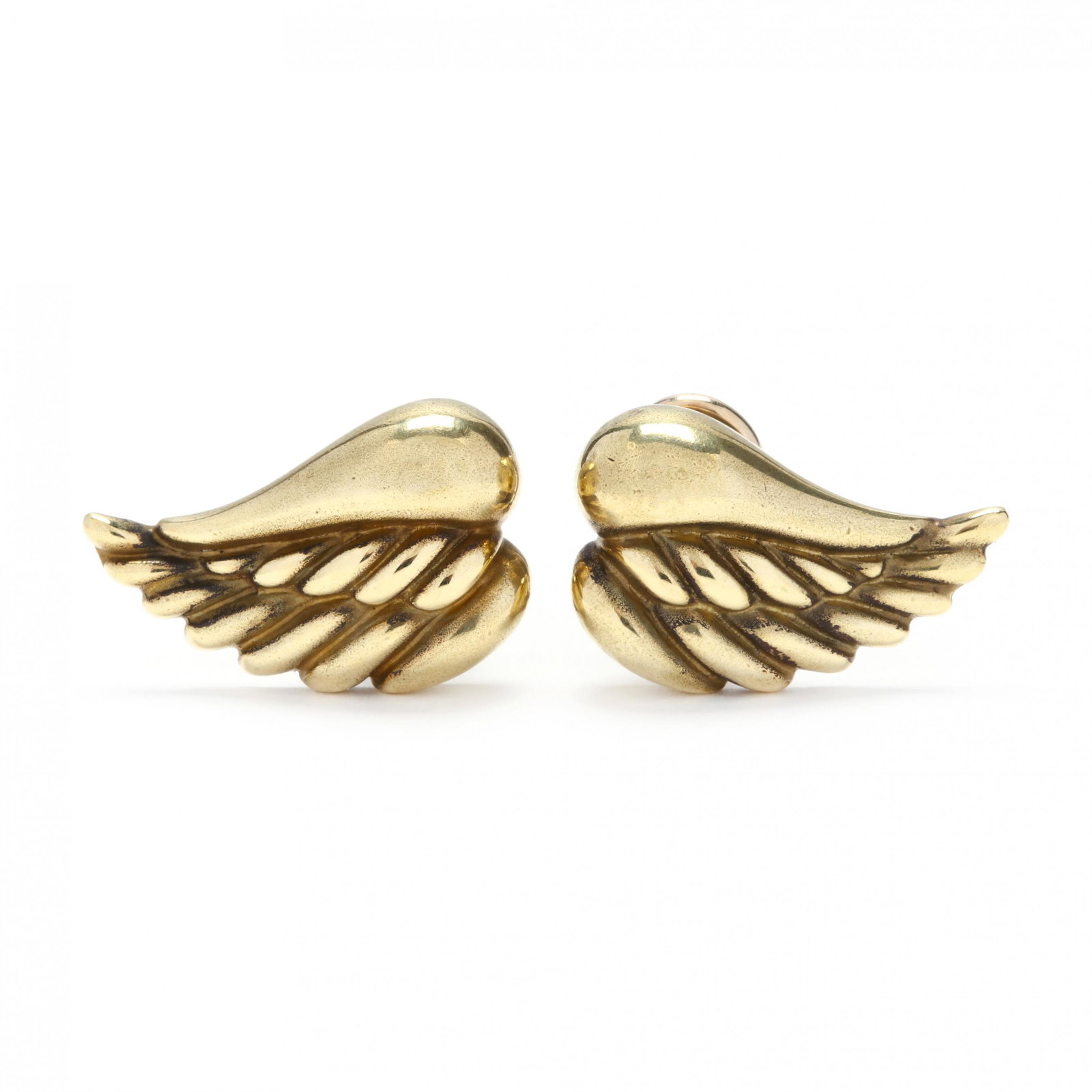 18KT Gold "Wing" Earrings, Kieselstein Cord: 18KT Gold "Wing" Earrings, Kieselstein Cord designed in high polish yellow gold with ribbed detailing, completed with posts and omega clip backs, stamped 18K / 1976, signed, and with maker's mark. 1/2