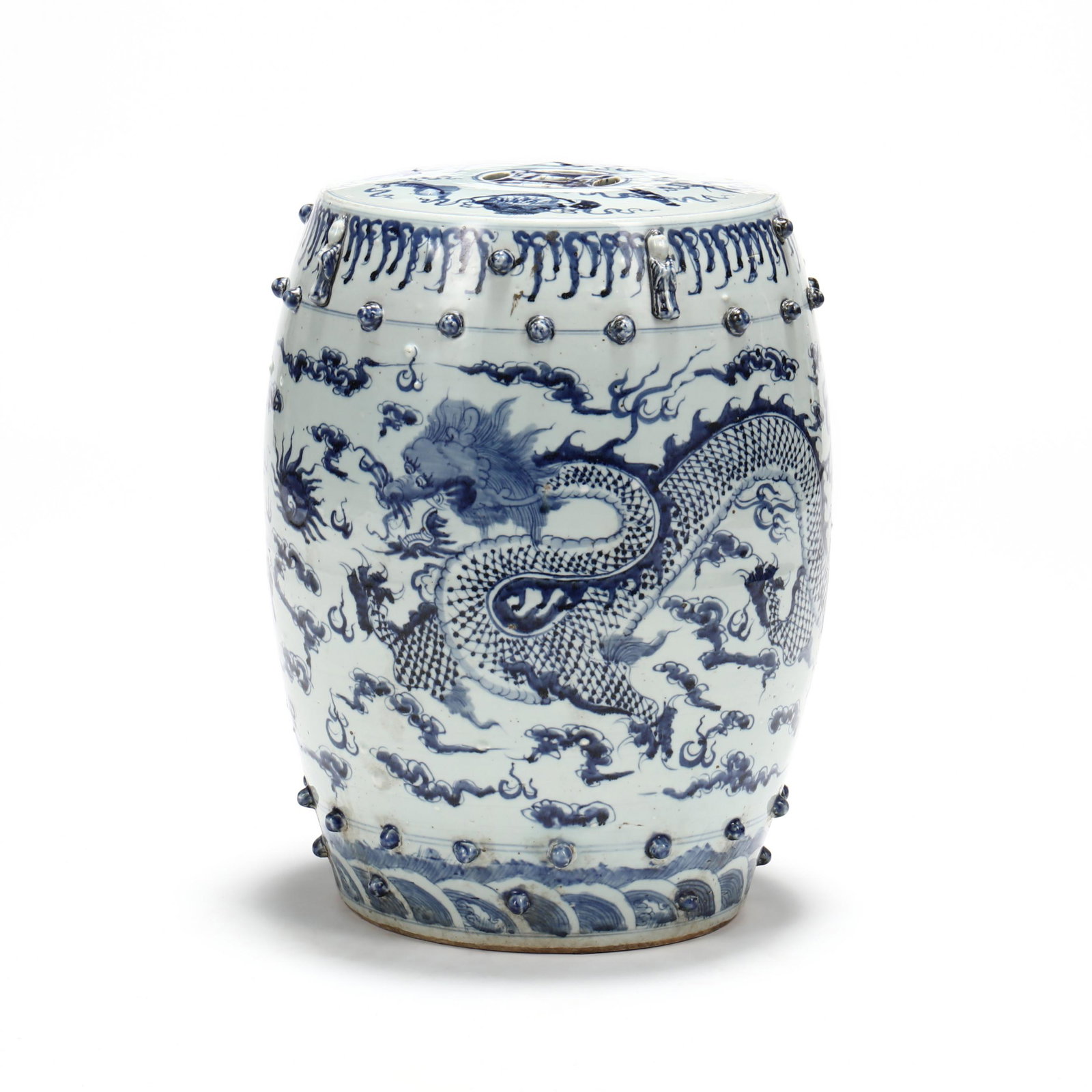 A Chinese Blue and White Porcelain Garden Seat: A Chinese Blue and White Porcelain Garden Seat 20th century, decorated on the top with the emblems of the Eight Daoist Immortals encircling a reticulated coin symbol in the center, the body of the sea