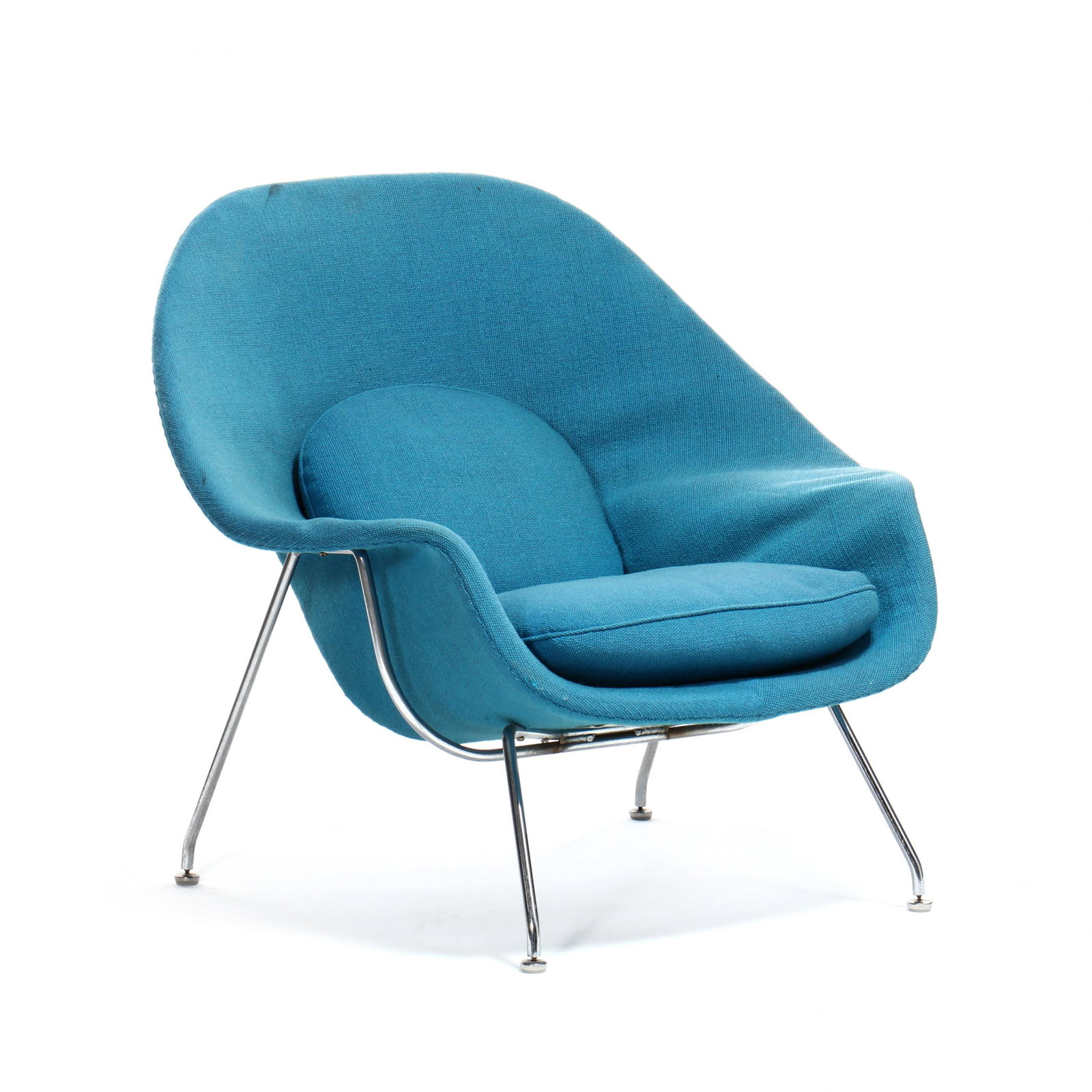 Eero Saarinen (Finnish/American, 1910-1961), Womb Chair: Eero Saarinen (Finnish/American, 1910-1961), Womb Chair designed 1948, Knoll Associates, original blue upholstery with back and seat cushions on polished steel legs, labeled. 35 x 38.5 x 33 in. Born i