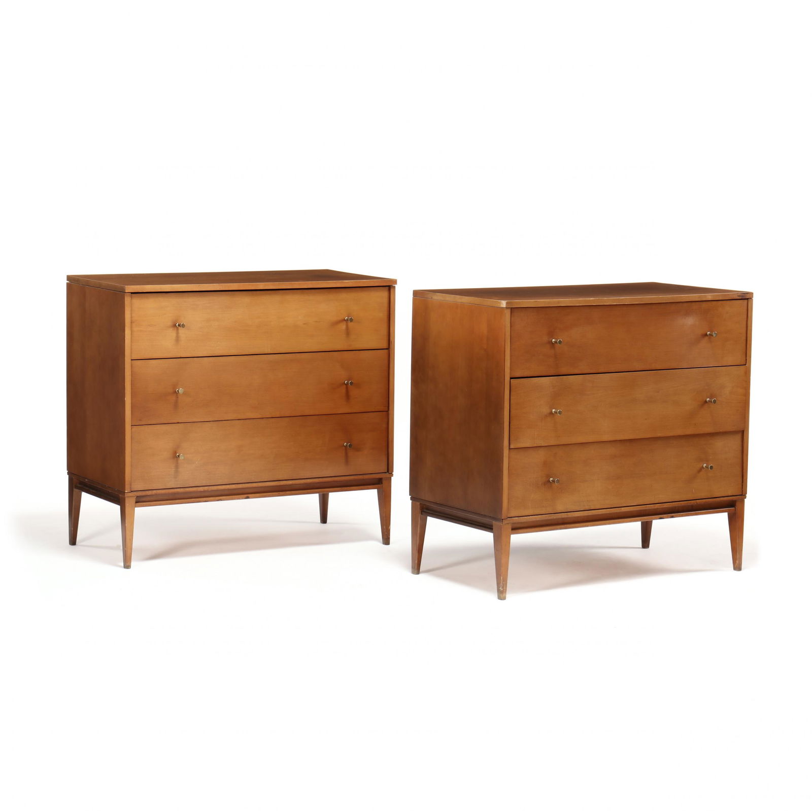 Paul McCobb, Pair of Maple Chests of Drawers: Paul McCobb, Pair of Maple Chests of Drawers1950s, Planner Group, each case with three flush drawers and original brass pulls on tapered legs, labeled. 33.5 x 36 x 18.25 in. Additional high-resolutio