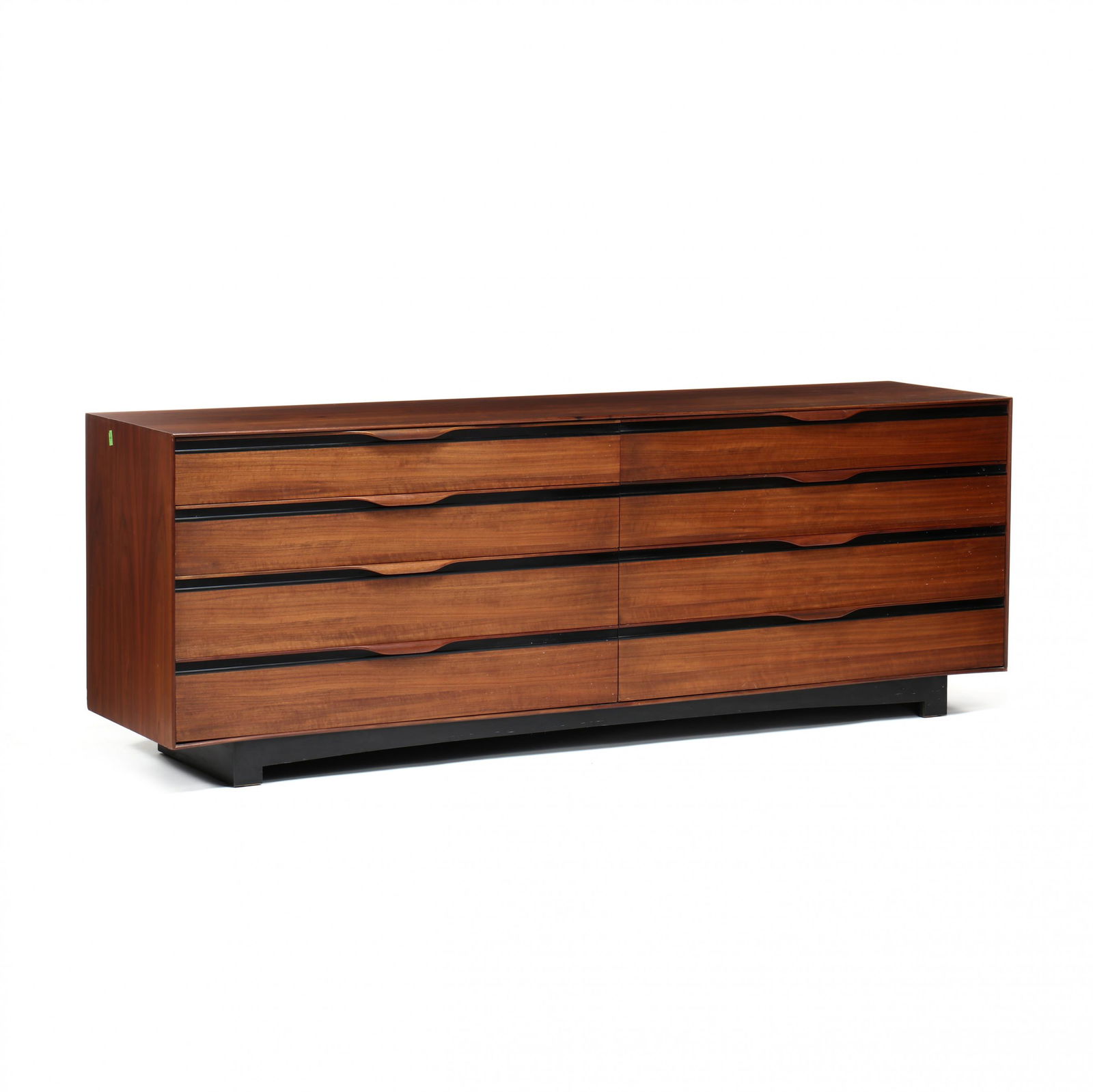 John Kapel (Am., b.1922), Mid-Century Walnut Dresser: John Kapel (Am., b.1922), Mid-Century Walnut Dresser1960s, manufactured by John Stuart, low rectangular form with eight graduated drawers featuring a shaped lipped pull, on recessed block feet, labele