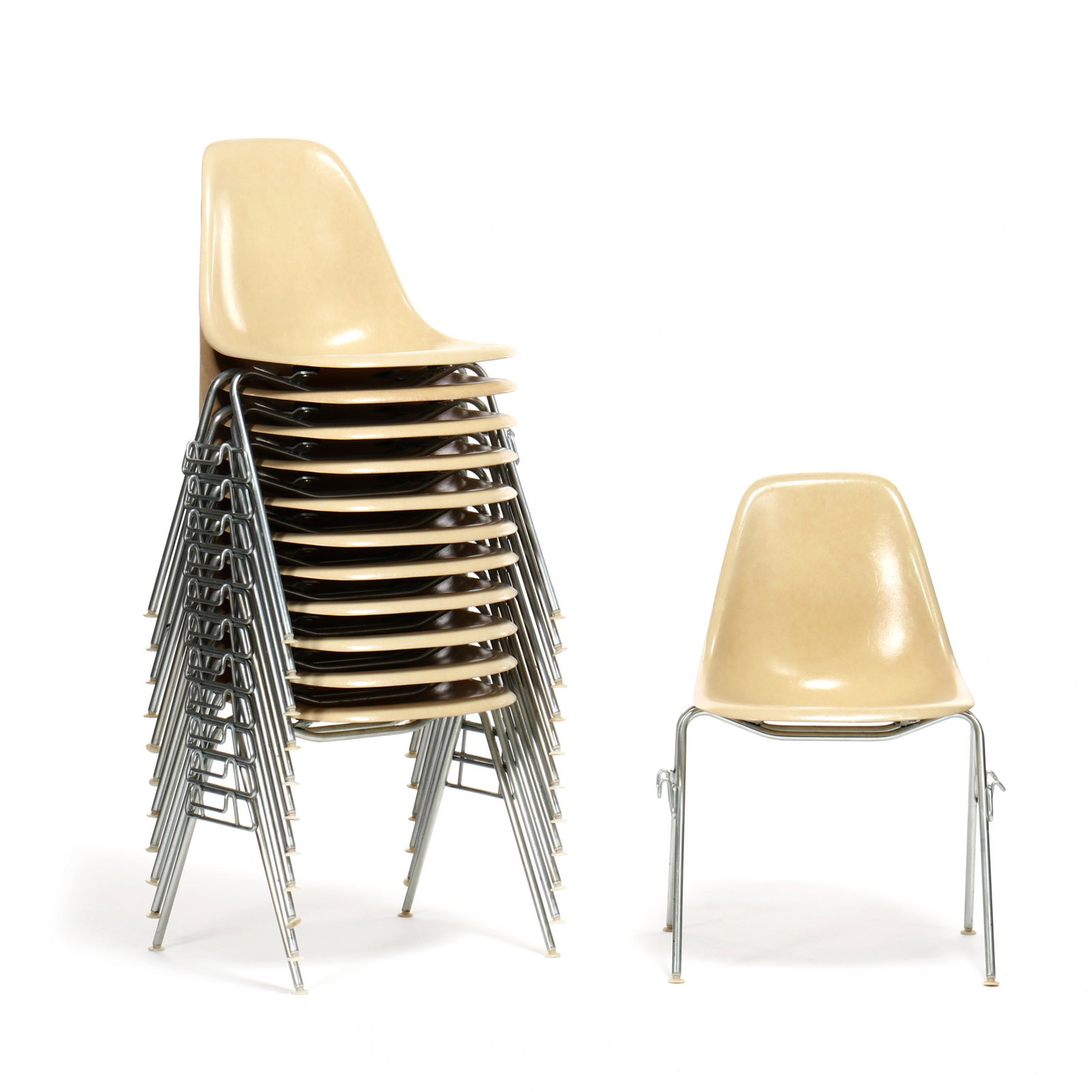 Charles and Ray Eames, Set of Twelve DSS Chairs: Charles and Ray Eames, Set of Twelve DSS Chairs Herman Miller, 1954, fiberglass shell, aluminum frame, white plastic feet, labeled. Charles and Ray created this design in response to demands for a lig