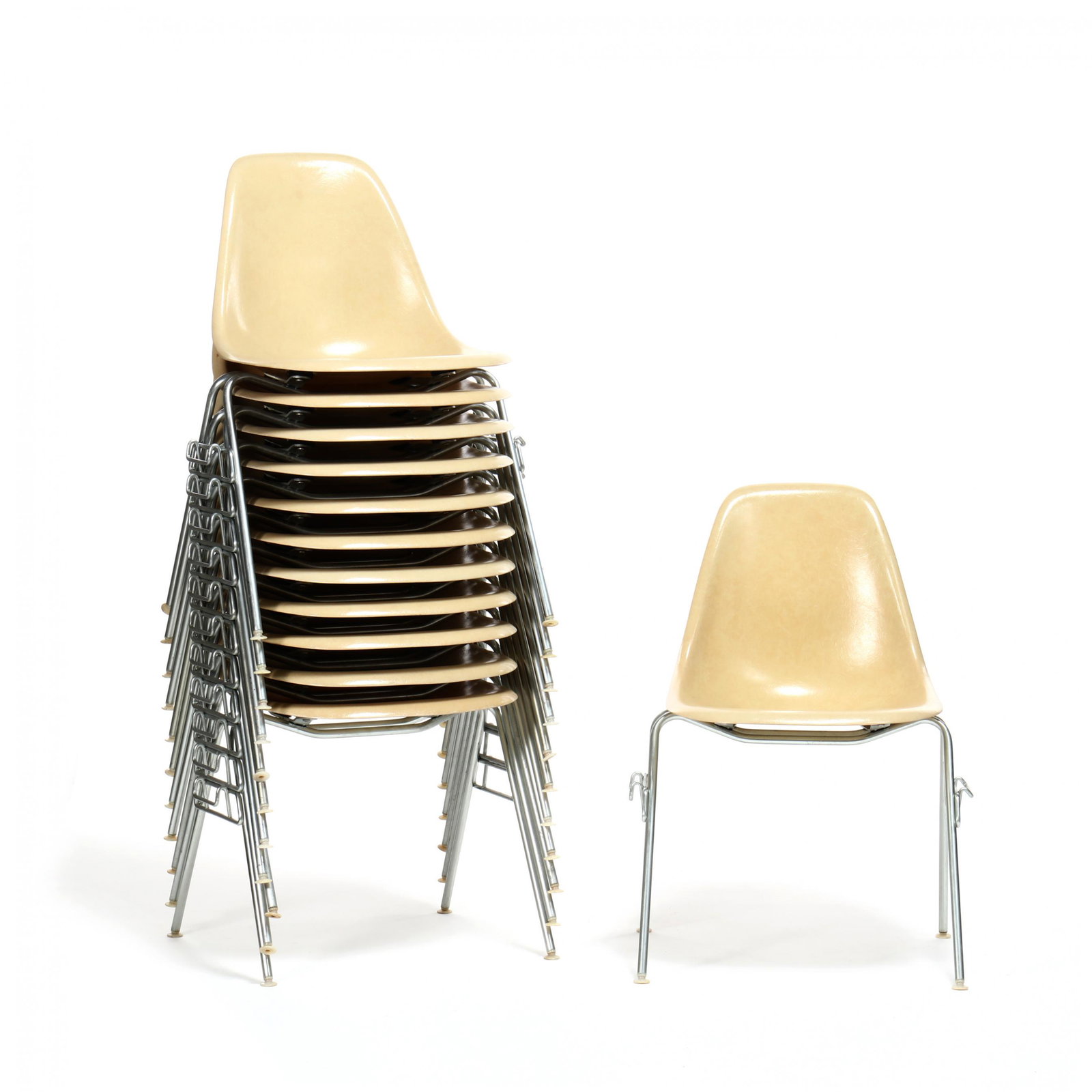 Charles and Ray Eames, Set of Twelve DSS Chairs: Charles and Ray Eames, Set of Twelve DSS Chairs Herman Miller, 1954, fiberglass shell, aluminum frame, white plastic feet, labeled. Charles and Ray created this design in response to demands for a lig