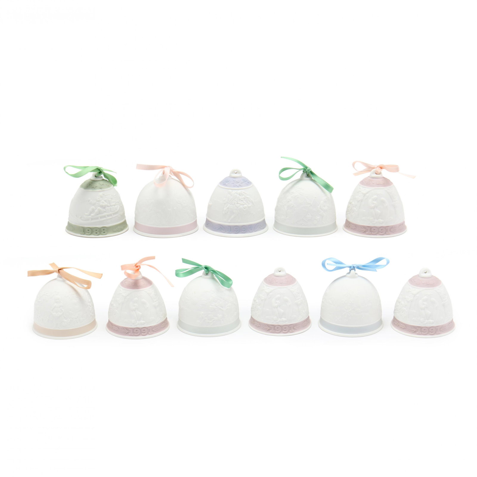 A Group of Eleven Lladro Bells, Most Collector's: A Group of Eleven Lladro Bells, Most Collector's Society matte finish, to include: two 1992 Summer Bells relief design of sea shore and boats, one with box; a 1994 Winter Bell in box; 1993 Fall Bell i