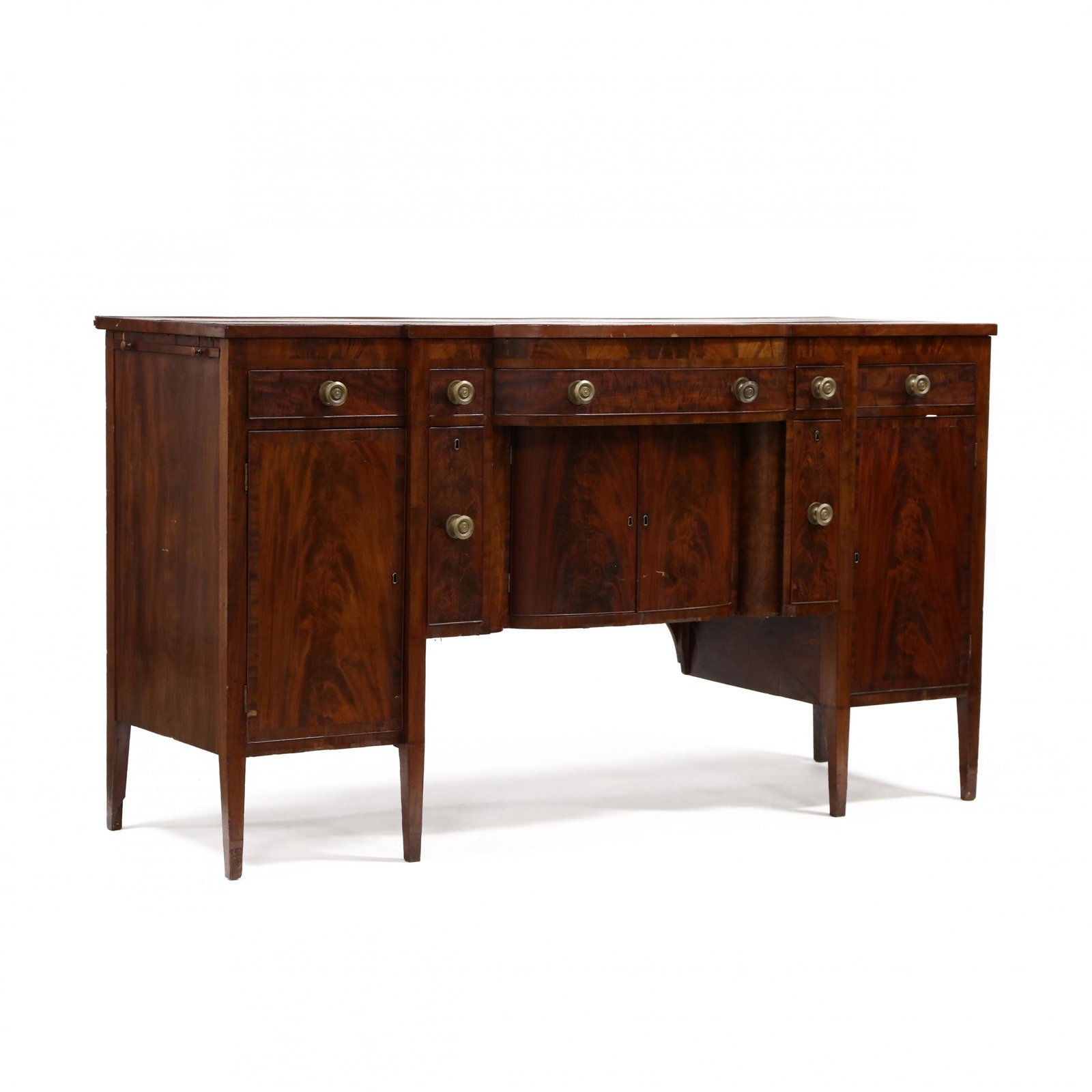 Mid-Atlantic Hepplewhite Mahogany Sideboard: Mid-Atlantic Hepplewhite Mahogany Sideboard circa 1800, mahogany, mahogany veneer, white pine secondary, bowfront form, central convex drawer over two hinged convex doors with open interior, flanked b