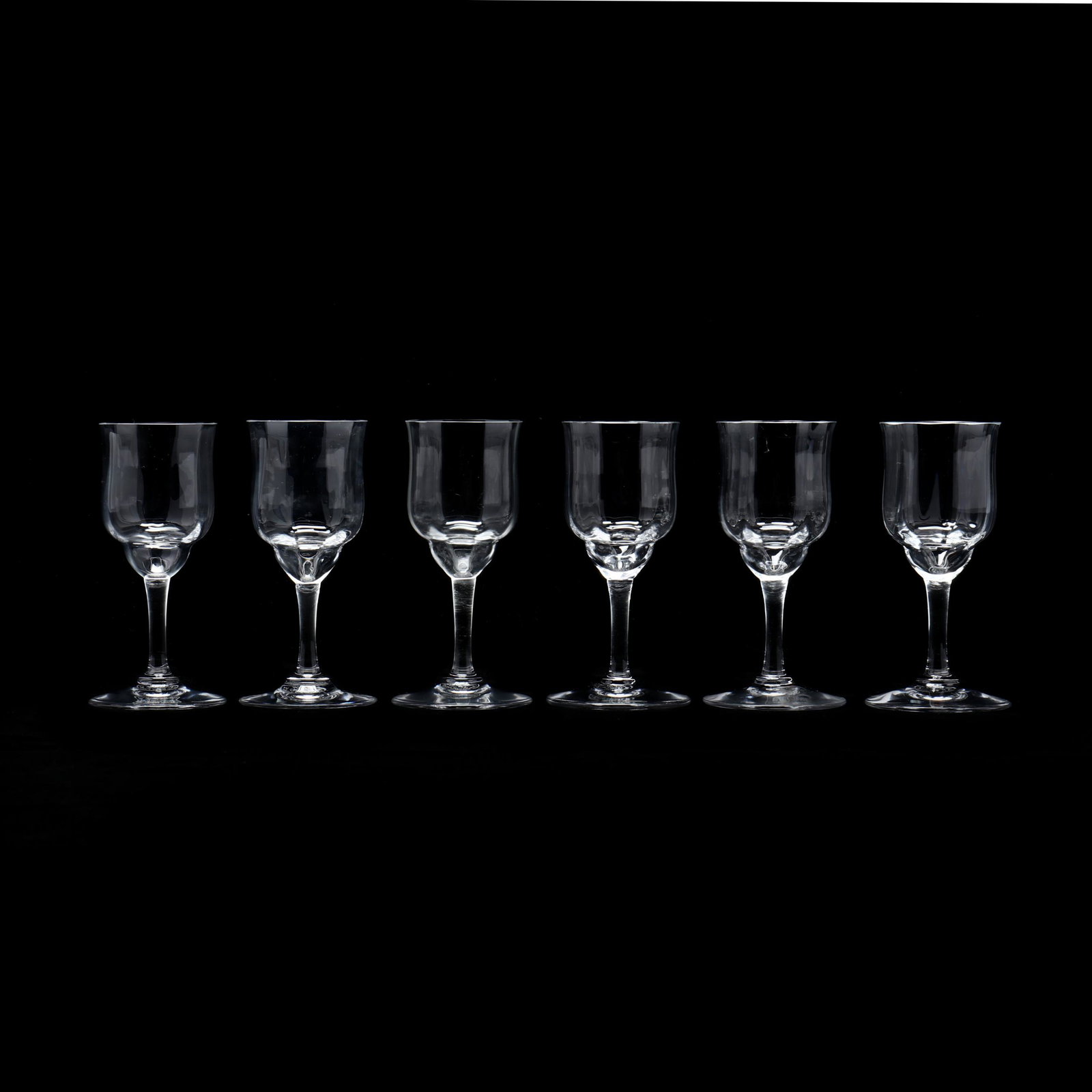 Cased Set of Six Baccarat Crystal Cordials for Cartier: Cased Set of Six Baccarat Crystal Cordials for Cartier mid 20th century, clear crystal cordials with an optic pattern, signed Baccarat, in a Cartier presentation case with blue velvet lining. 3.75 in.