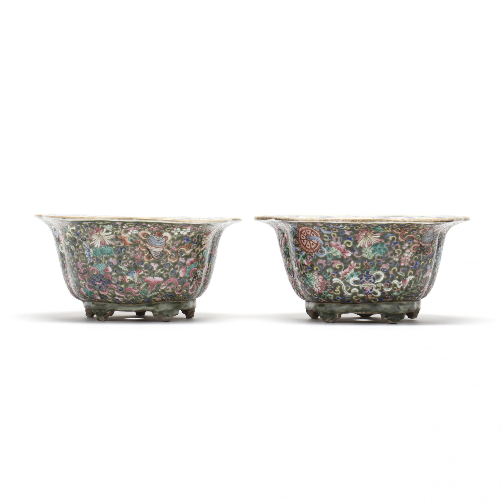 A Pair of Chinese Porcelain Jardinieres: A Pair of Chinese Porcelain Jardinieres 19th century, olive green ground decorated in polychrome enamels with Buddhist treasures amidst scrolling peony blossom vines, shaped edges with flat rim having