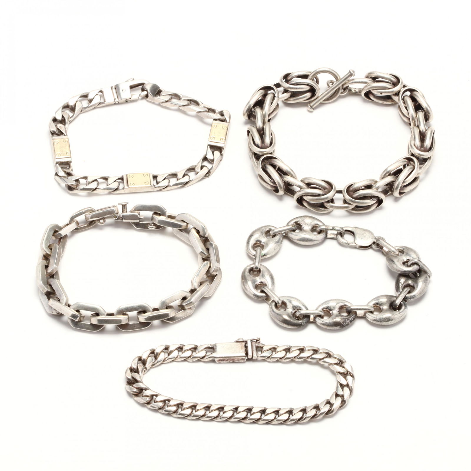 Five Silver Link Bracelets: Five Silver Link Braceletsto include: a large fancy link bracelet with a toggle clasp (stamped 925; 9 in.); a rectangular link bracelet (stamped MEXICO / 925; 8 in.); a curb link bracelet with rectang