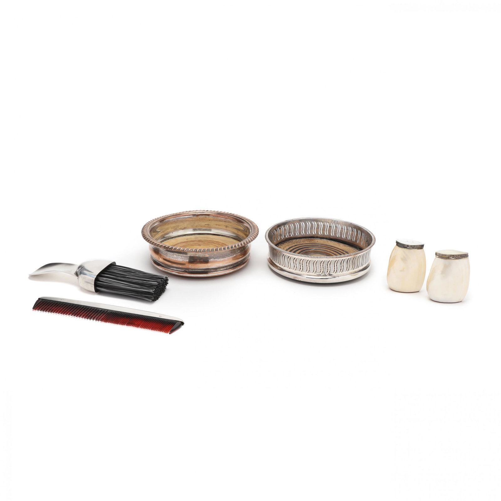 A Grouping of Silver Accessories: A Grouping of Silver Accessories to include: (1) sterling silver shoe horn/brush and comb, marked Gorham, in a cloth case (7 in.); (2) antique silverplate wine coasters with wood bases, both unmarked