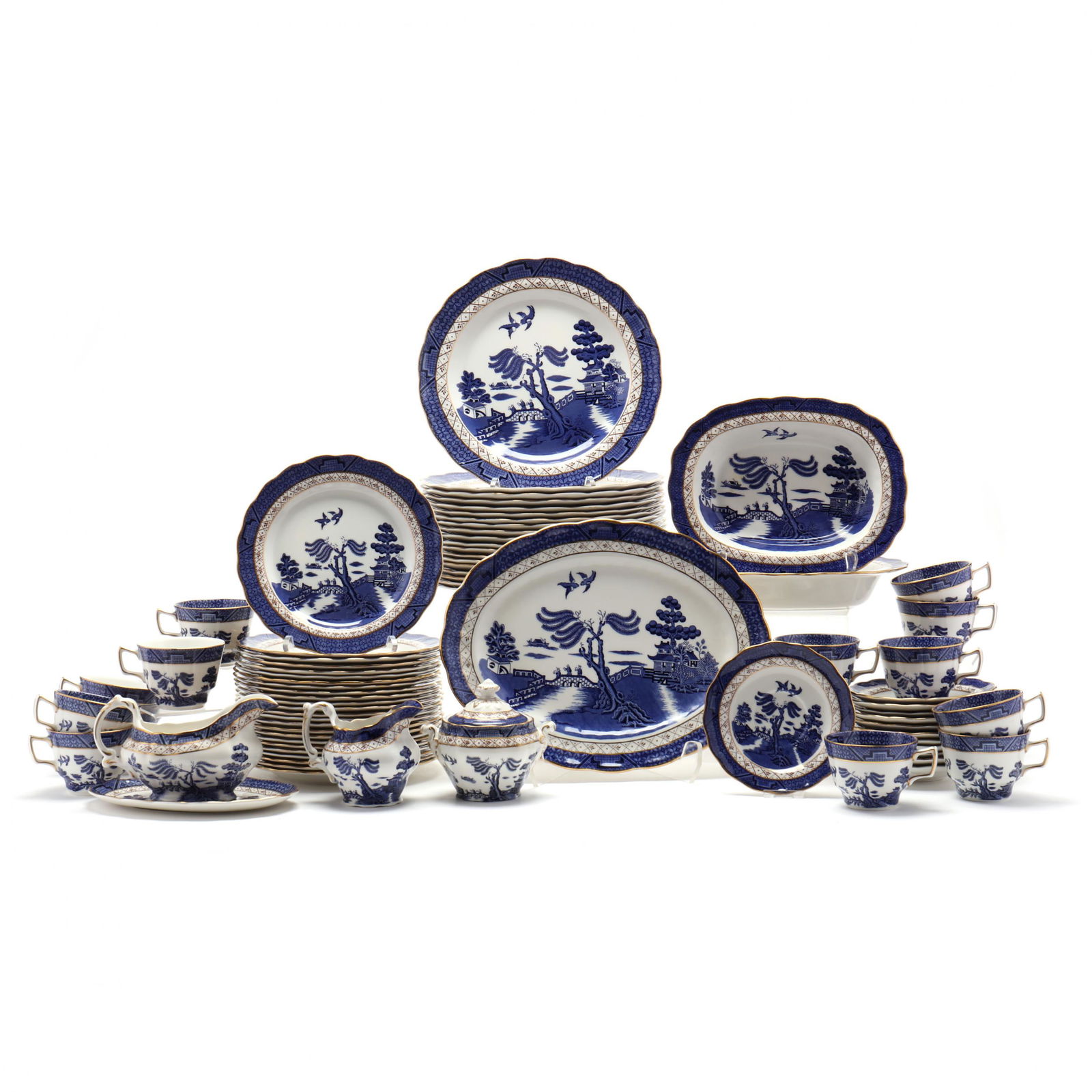 (75) Piece Set of Royal Doulton Tableware "Booth's Real: (75) Piece Set of Royal Doulton Tableware "Booth's Real Blue Willow"The Majestic Collection 1981: (19) plates (10.5 in.); (24) plates (8.5 in.); (13) cups with twelve saucers; a covered sugar; a cream