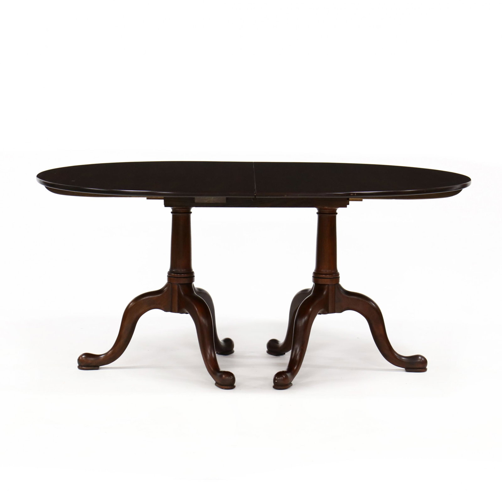 Henkel Harris, Queen Anne Style Mahogany Double: Henkel Harris, Queen Anne Style Mahogany Double Pedestal Dining Tablelate 20th century, finish no. 29, oval top with rounded edge, ring-turned standards with cabriole legs on pad feet, labeled. 30 x 6