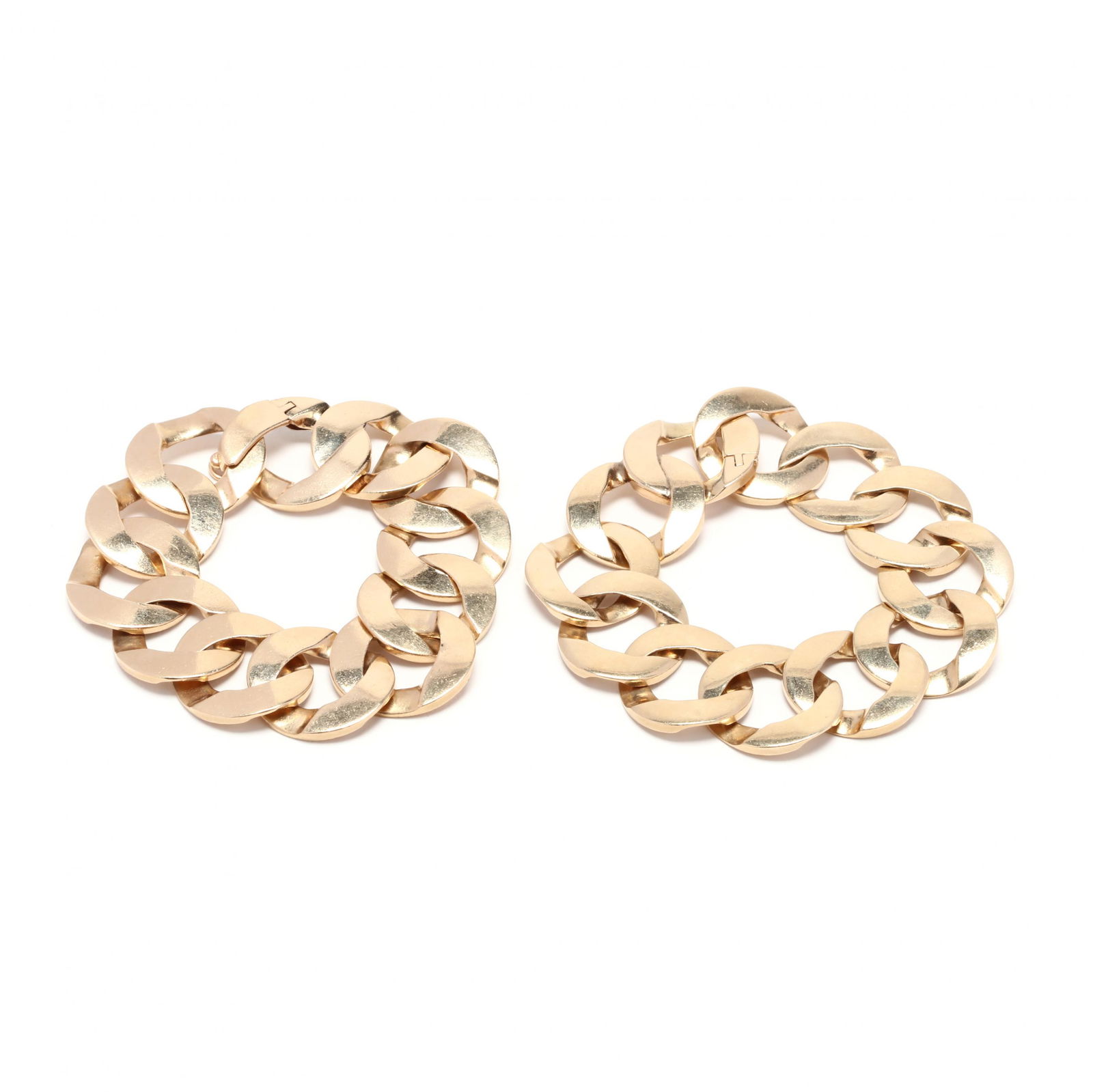 Pair of 14KT Gold Link Bracelets: Pair of 14KT Gold Link Braceletsbracelets comprised of flat, oval links completed with a fold over clasp, stamped 14K. 1 x 7.5 in. 107.0 total dwts. From the Estate of Rita Barg, a long time antique d