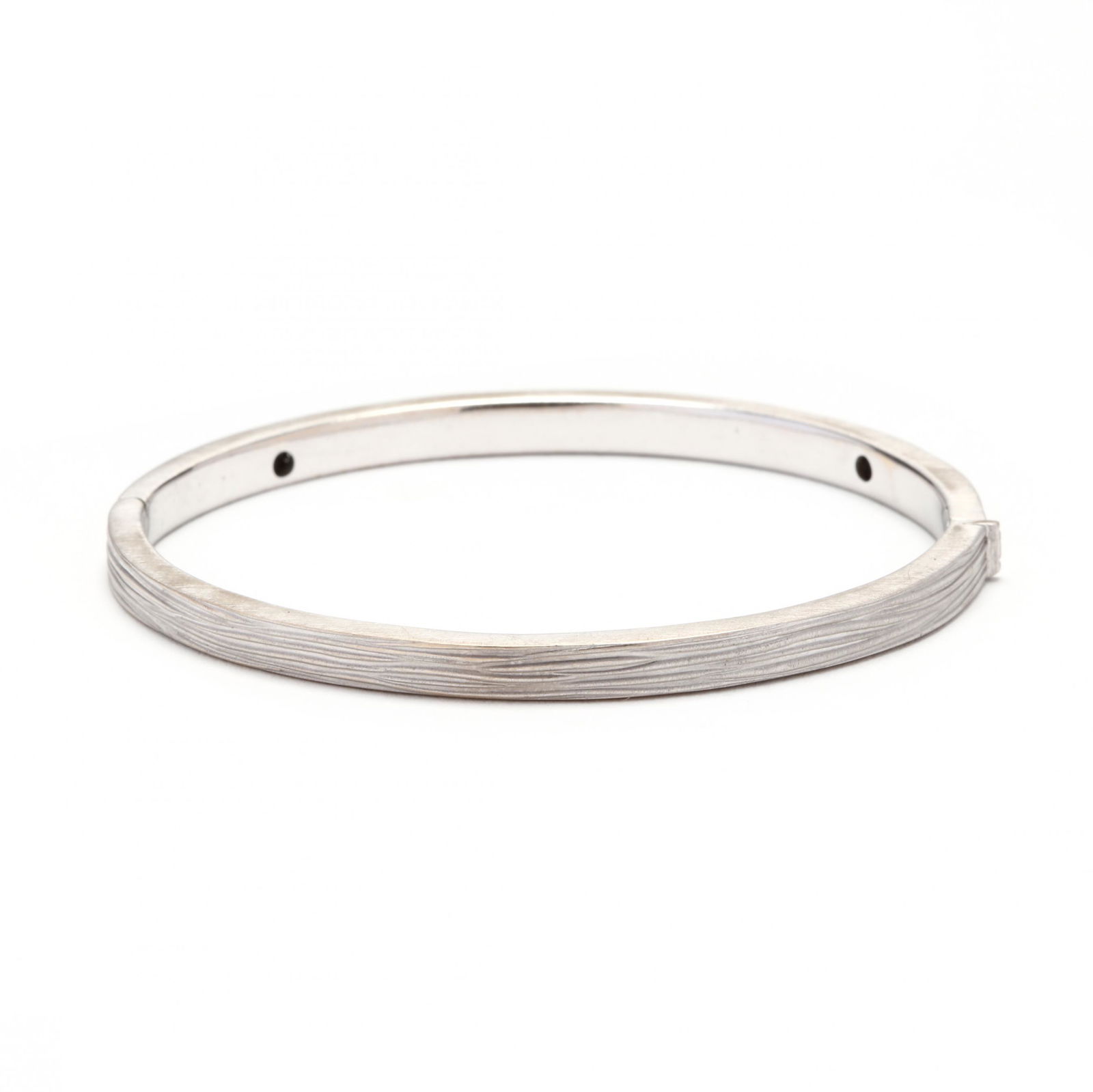 18KT White Gold "Elephant Skin" Bracelet, Roberto Coin: 18KT White Gold "Elephant Skin" Bracelet, Roberto Coinfrom the Elephant Skin Collection, of oval, hinged bangle form accented with a flush set full cut round diamond melee, stamped 18K / Italy, with I