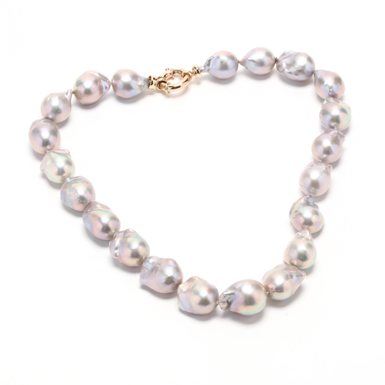 14KT Gold Baroque Pearl Necklace: 14KT Gold Baroque Pearl Necklace strung knotted with (21) slightly graduated baroque pearls (19.5 x 24.5mm to 15.5 x 18.2mm) and completed with a gold spring ring clasp stamped for 14KT. 19.5 in. Pear