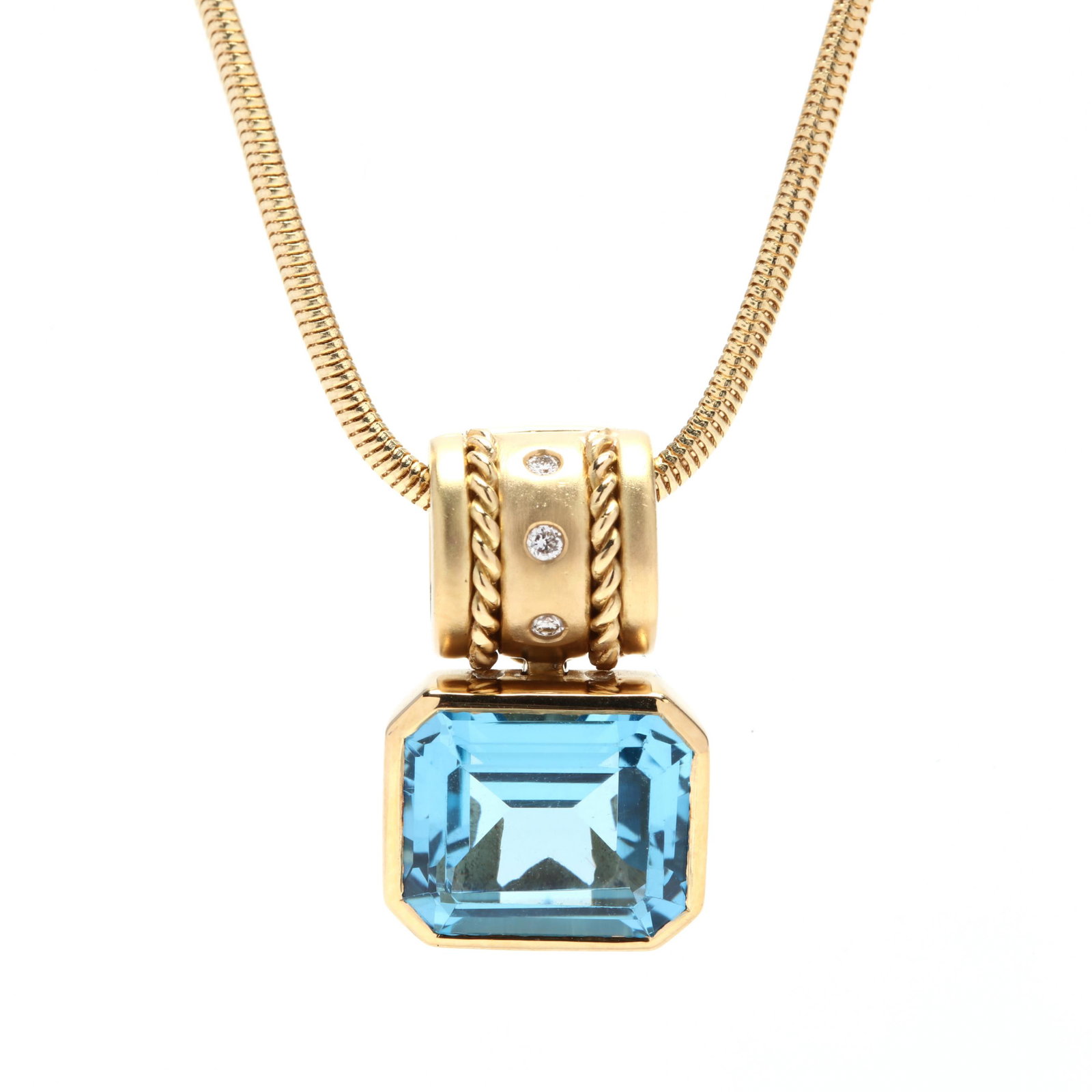 18KT Gold, Blue Topaz, and Diamond Necklace: 18KT Gold, Blue Topaz, and Diamond Necklace the bezel set, emerald cut blue topaz (12 x 10 mm) pendant with a wide hinged bail set with full cut round diamond melee accents suspended from a snake chai