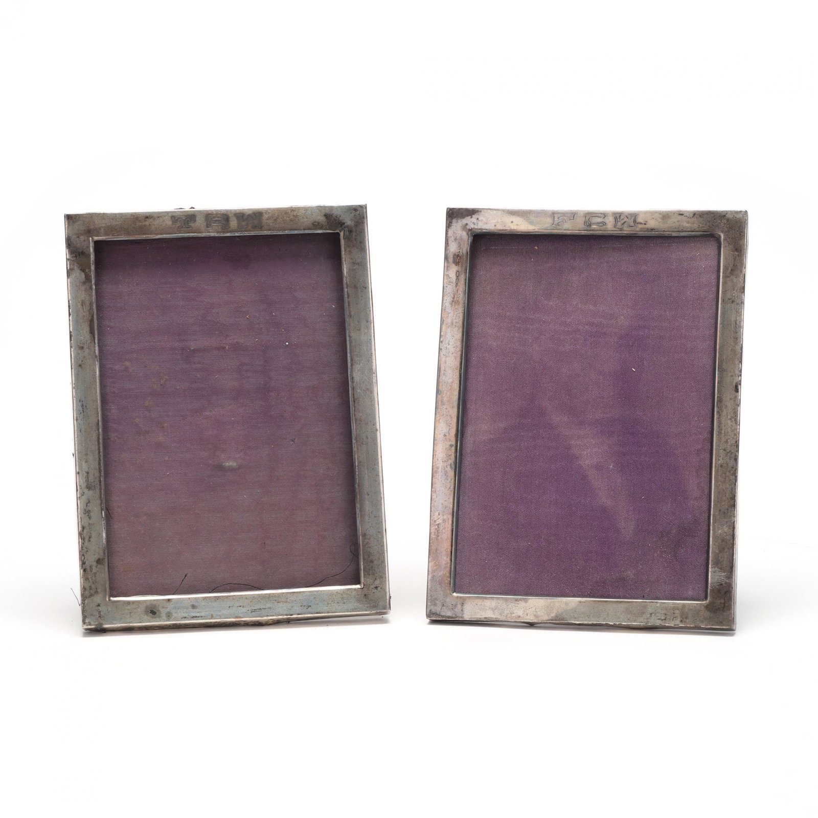 Two Sterling Silver Picture Frames: Two Sterling Silver Picture Framesthe first engraved "FCW" and the second engraved "TAW," each with mark of Clarence A. Vanderbilt, model number 305. DOA 7 1/8 x 5.25 in. 2.7 troy oz. From the Collect