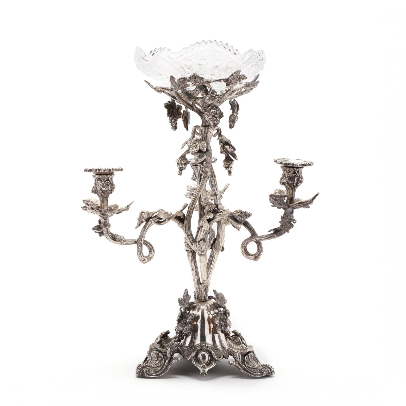 A Silvered Bronze Epergne: A Silvered Bronze Epergne unmarked, likely a 20th century reproduction of a Victorian example, naturalistic grapevine motif with three scrolling candle arms and central standard supporting a later pre