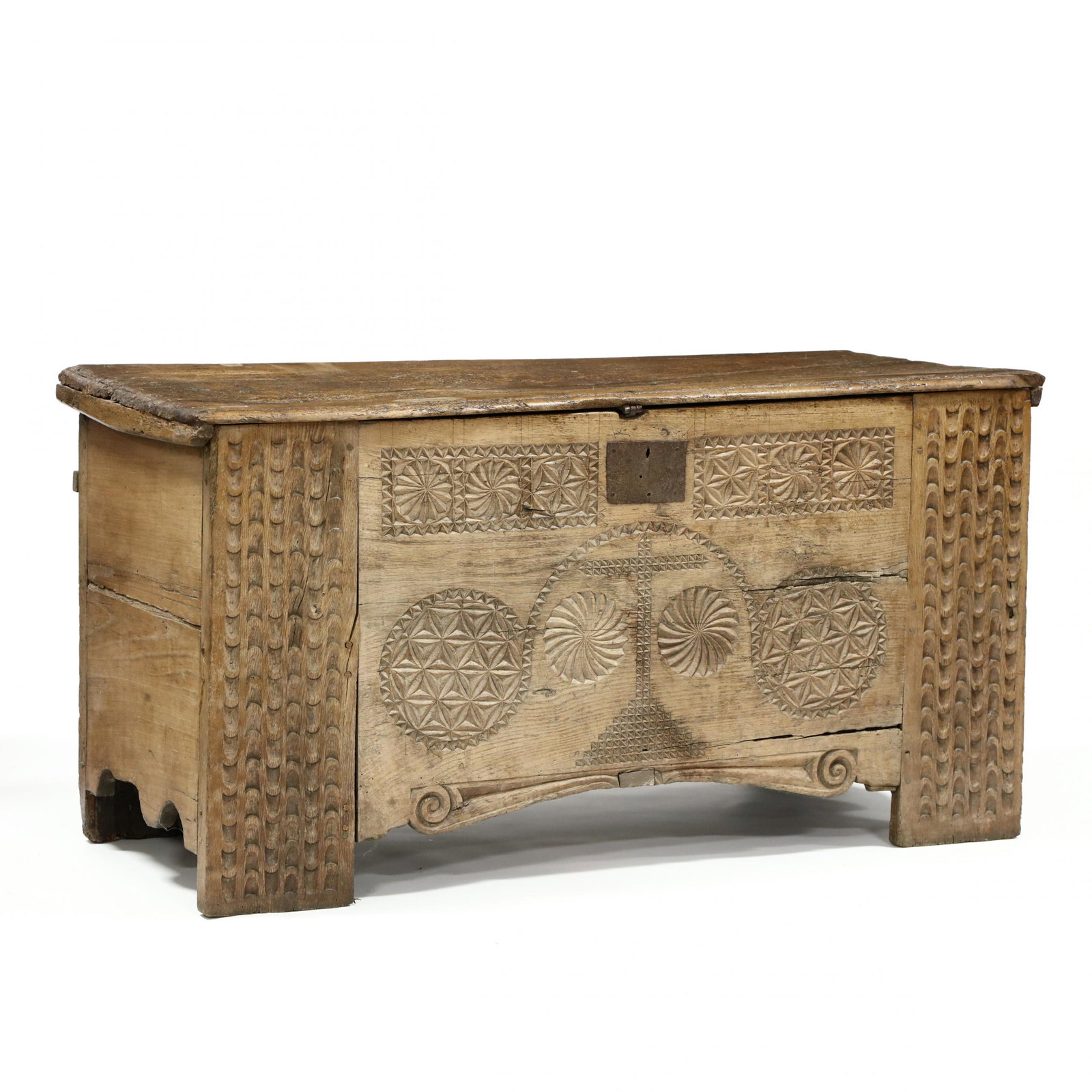 Antique Spanish Carved Walnut Coffer: Antique Spanish Carved Walnut Coffer 18th century, wide single-board hinged lid with molded edge, fish-tail hinges, interior with till (missing lid), the front with relief carved cross and pinwheels, 