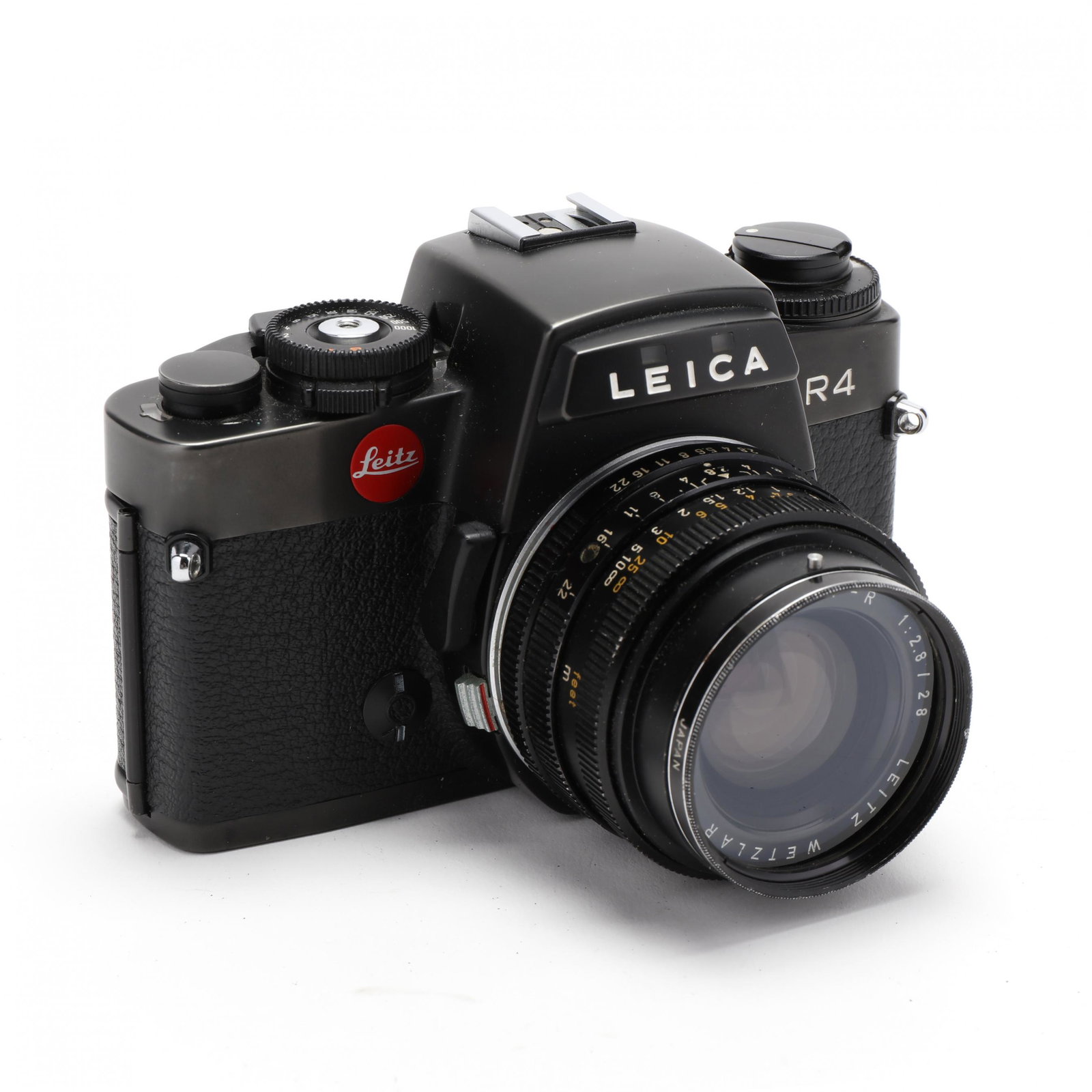 Leica R4 35mm Camera and Leitz Wetzlar Elmarit 28mm: Leica R4 35mm Camera and Leitz Wetzlar Elmarit 28mm Lens made in Germany, the lens serial number is 2509696; the unit assembled and secured in a black leather Leica case. Camera alone 4 x 5.5 x 2.5 in