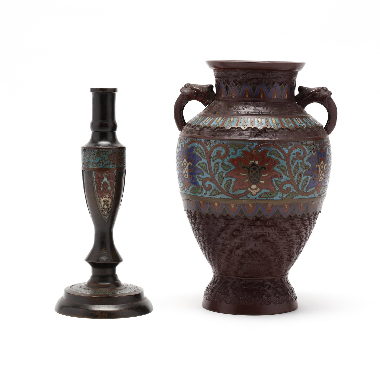 An Asian Champleve Vase and Candlestick: An Asian Champleve Vase and Candlestick late 19th or early 20th century, includes a vase with multiple bands of champleve enamel inlay alternating with key motif, handles flank the upper body, high fo