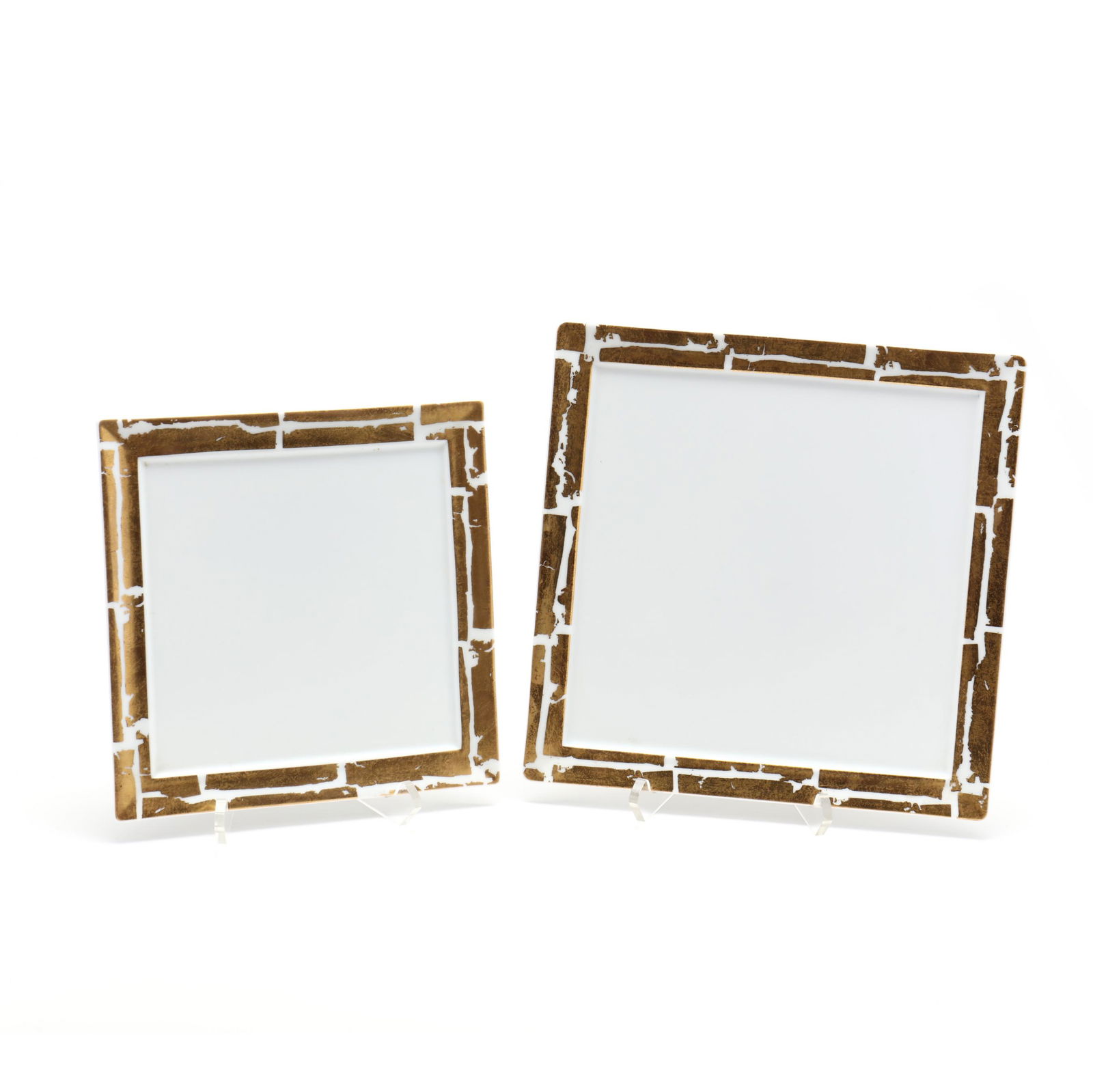 Two Nesting Bernardaud Porcelain Trays: Two Nesting Bernardaud Porcelain Traysmade in France, square form with asymmetrical cold leaf border. Larger 10.25 in. Bernardaud has been creating quality porcelain in Limoges since 1863. The Collect