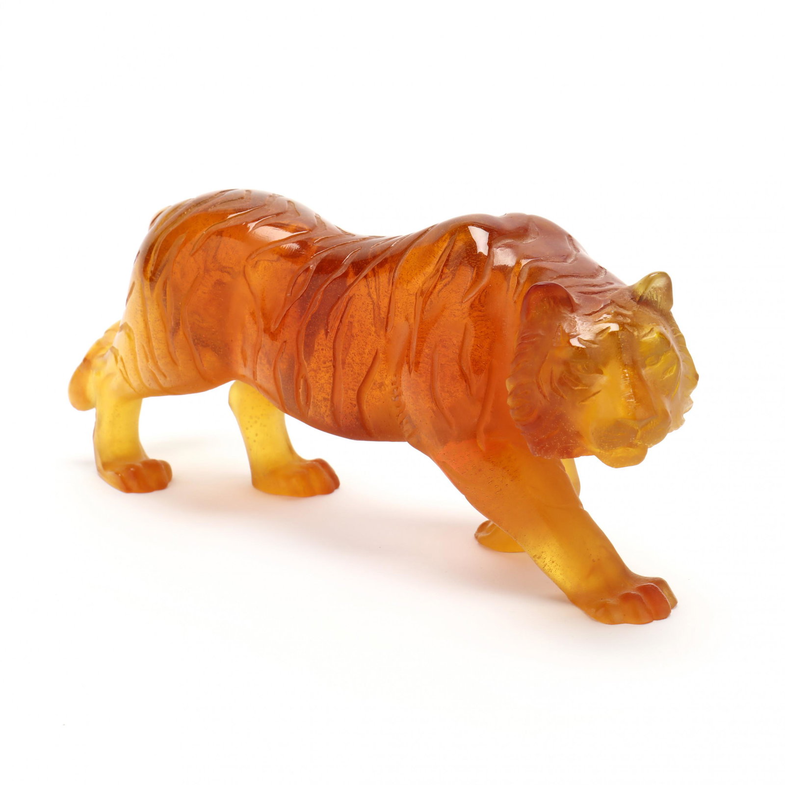 Daum, Pate de Verre Glass Prowling Tiger: Daum, Pate de Verre Glass Prowling Tiger France, late 20th century, rich amber colored glass with acid cut stripes, signed to rear left foot. 4.5 x 11 x 3 in. Additional high-resolution photos are ava