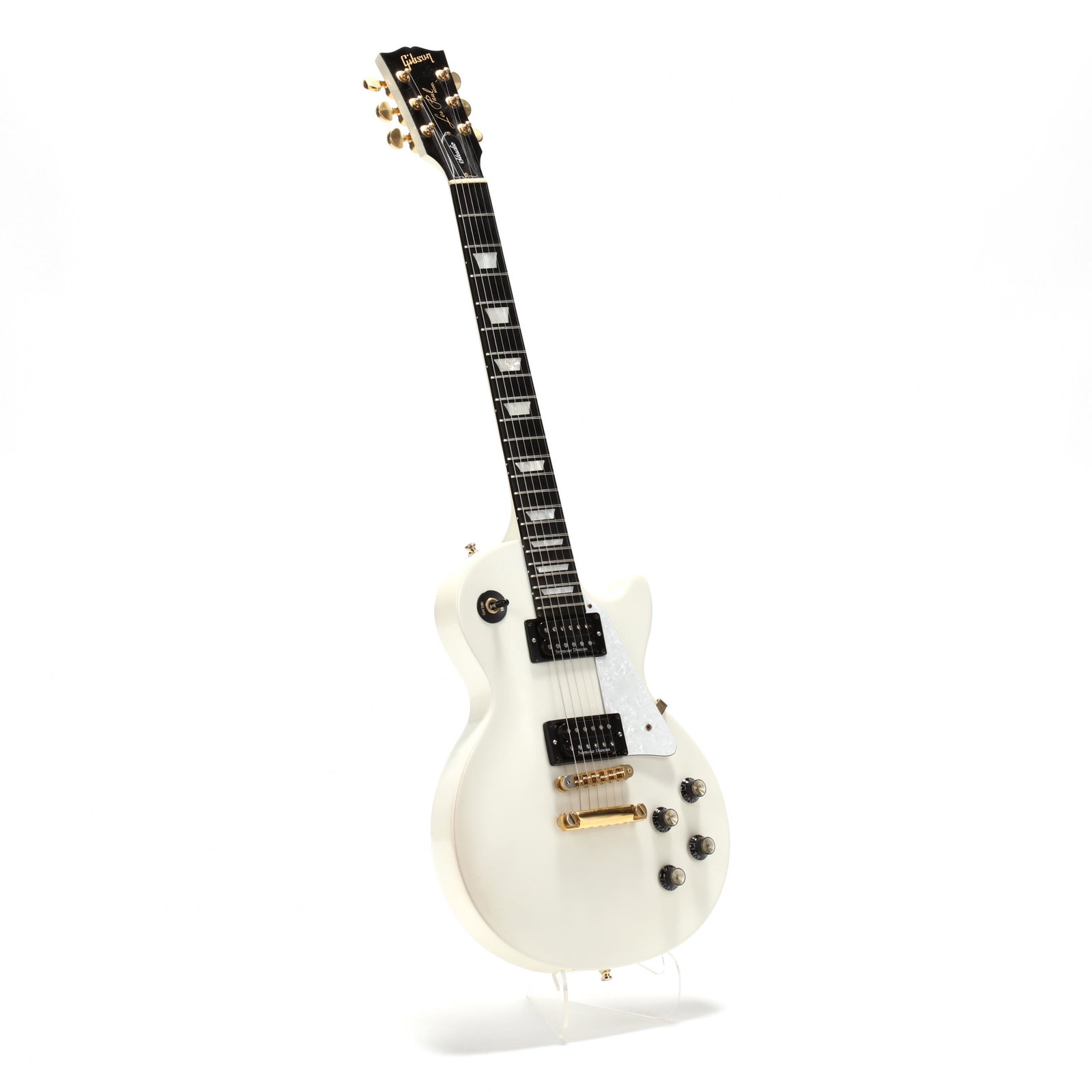 2003 Gibson Les Paul Classic Electric Guitar: 2003 Gibson Les Paul Classic Electric Guitar serial 031760694 and "Made in U.S.A." stamped on headstock, white finish with white pearloid pickguard, rosewood fretboard with abalone inlay position mark