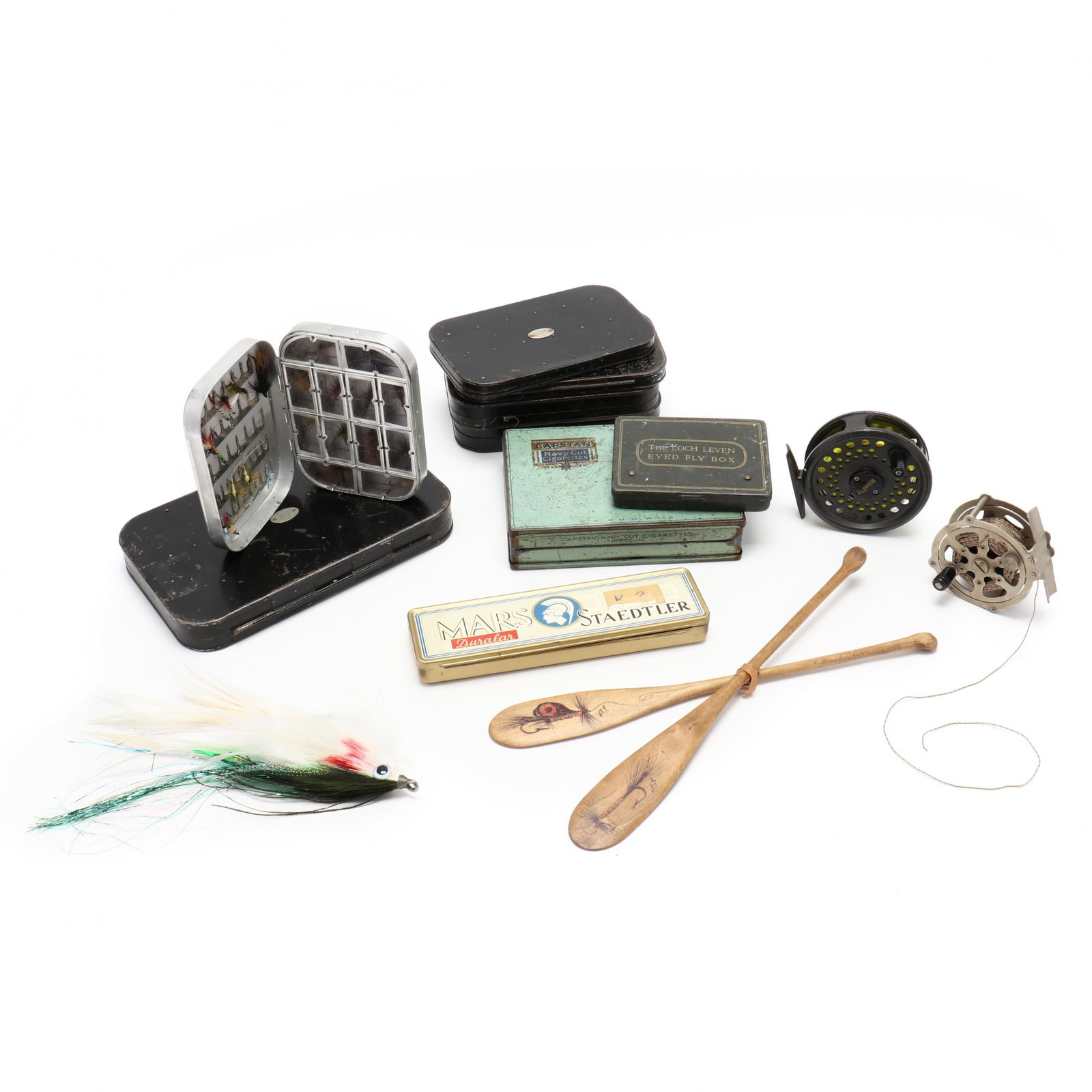 Collection of Vintage Fishing Flies and Two Fly Reels: Collection of Vintage Fishing Flies and Two Fly Reels to include nine lidded tins of hand-tied flies; a large fantasy or salesman sample fly; an English Cortland Rim Fly reel; an Olympic Silver Fox sk