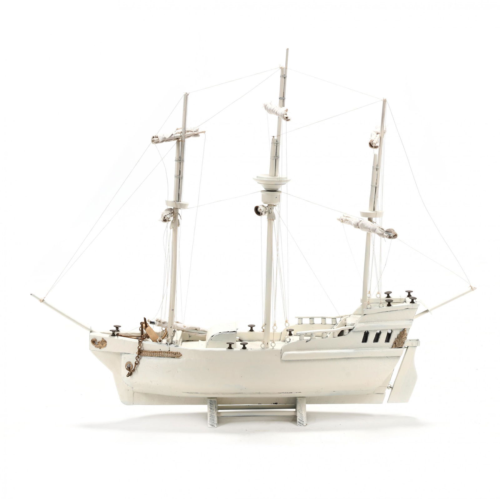 Fanciful Model of an Early Eighteenth Century Galleon: Fanciful Model of an Early Eighteenth Century Galleonearly 20th century with later white paint, with string rigging and a few gilt appliquÃ©s; set onto a custom stand. 30 x 36.25 x 6.75 in. From the