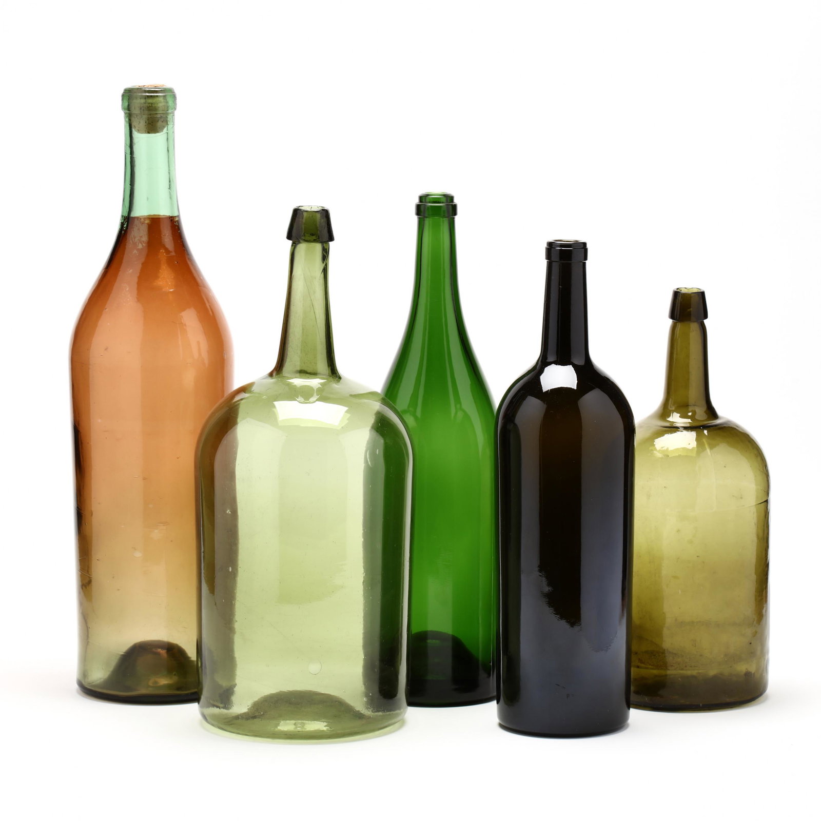 Five Large Green Glass Wine Bottles: Five Large Green Glass Wine Bottles various forms; one with tinting simulating liquid. Tallest 22.75 in. From the Personal Collection of Bob Timberlake, Lexington, North Carolina Additional high-resol