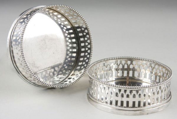 Pair of Silver Bottle Coasters, Dutch,: Pair of Silver Bottle Coasters, Dutch, of circular form with pierced rim and beaded edge, marked for second silver standard, 1916 date letter, maker's mark for J. Mes of Hoorn (active 1912-1958). 8.5