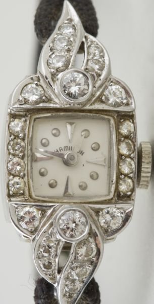 Hamilton Platinum and Diamond Lady's Watch,: Hamilton Platinum and Diamond Lady's Watch, underside of case marked "900 PLAT / .100 IRID", set with (24) round brilliant cut diamonds weighing 0.70 carats, with 1979 Bailey, Banks & Biddle appraisal