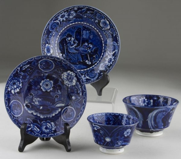 Two James Clews Staffordshire Cups and Saucers,: Two James Clews Staffordshire Cups and Saucers, ca. 1810, blue and white transfer decorated, the first "Christmas Eve" from a series of seven scenes from the paintings of Sir David Wilkie, RA; made fo