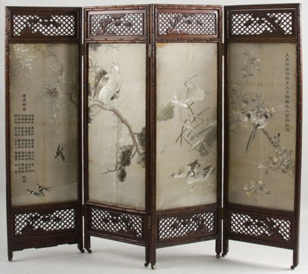 Oriental Four Panel Folding Screen, ca. 1900,: Oriental Four Panel Folding Screen, ca. 1900, rosewood, each panel with foliate carved lattice work over embroidered silk, the reverse with applied peony carving over lower lattice, on casters. 67.5",
