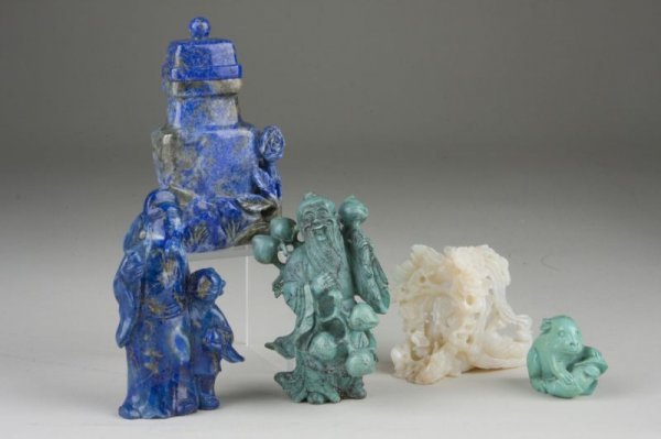 Group of Five Chinese Carvings, early 20th c.,: Group of Five Chinese Carvings, early 20th c., Turquoise farmer carrying branches of fruit, hairline to branch at left side, (3.3" x 1.5"); Australian opal , a phoenix, with areas of flash fire, sever