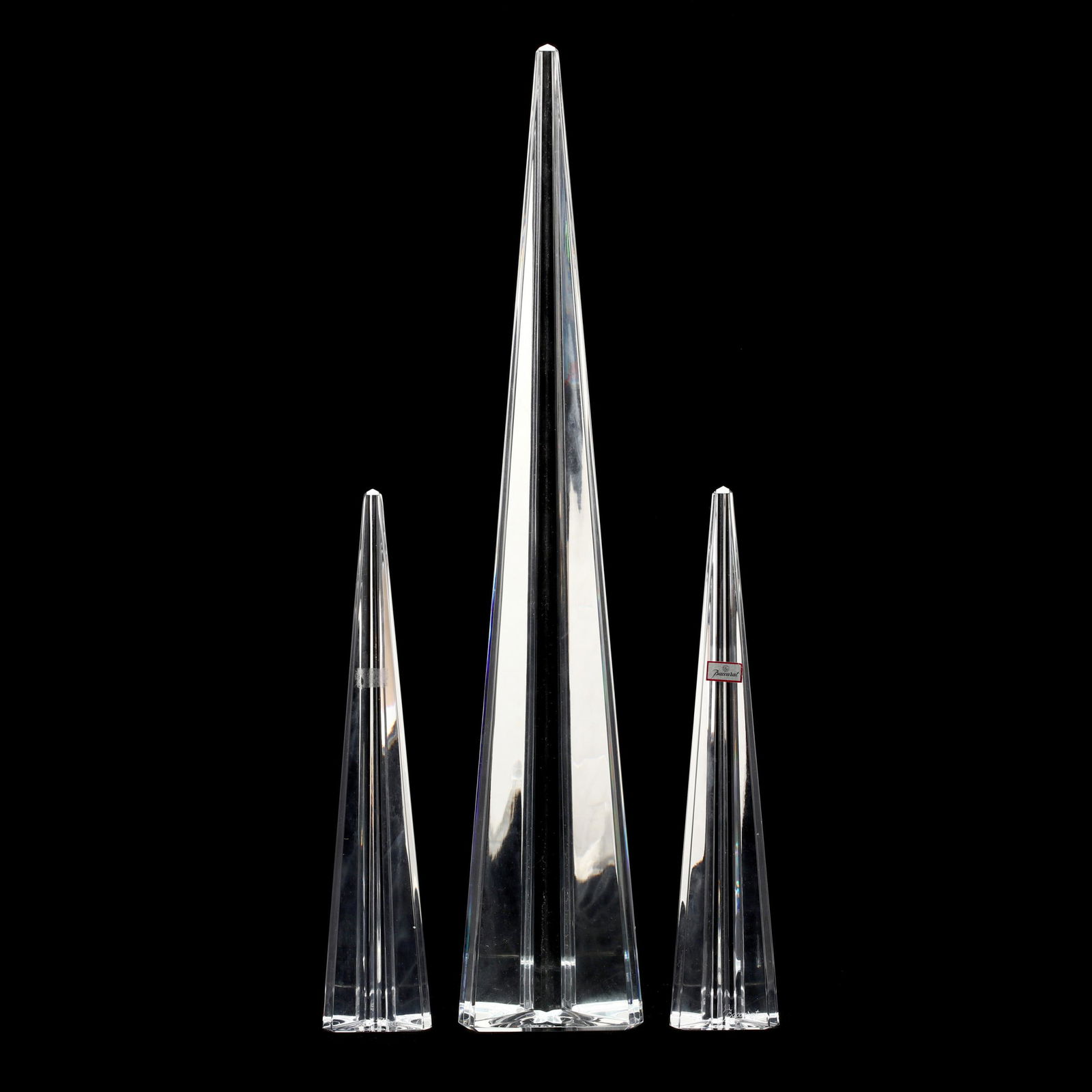 Baccarat, Three Crystal Obelisks: Baccarat, Three Crystal ObelisksFrance, polished crystal with linear cut edges creating a prismatic effect, signed. Tallest 18 in. The Collection of Mr. Duggins and Mr. Dunn, High Point, North Carolin