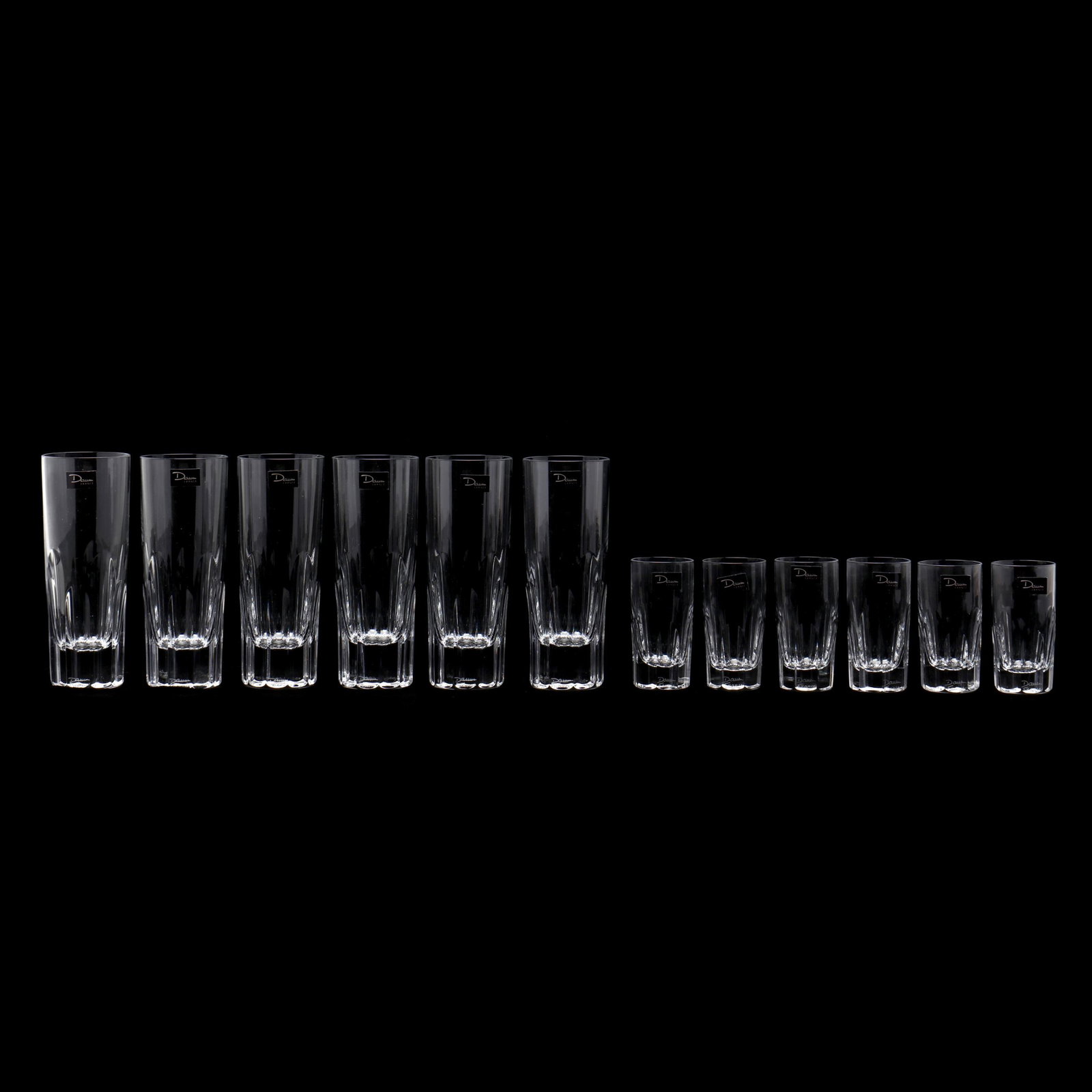 Daum, Twelve Beaulieu Crystal Glasses: Daum, Twelve Beaulieu Crystal Glasses France, late 20th century, including (6) shot glasses (3 in.), and (6) champagne flutes (5.5 in.), signed, in original boxes. The Collection of Mr. Duggins and Mr