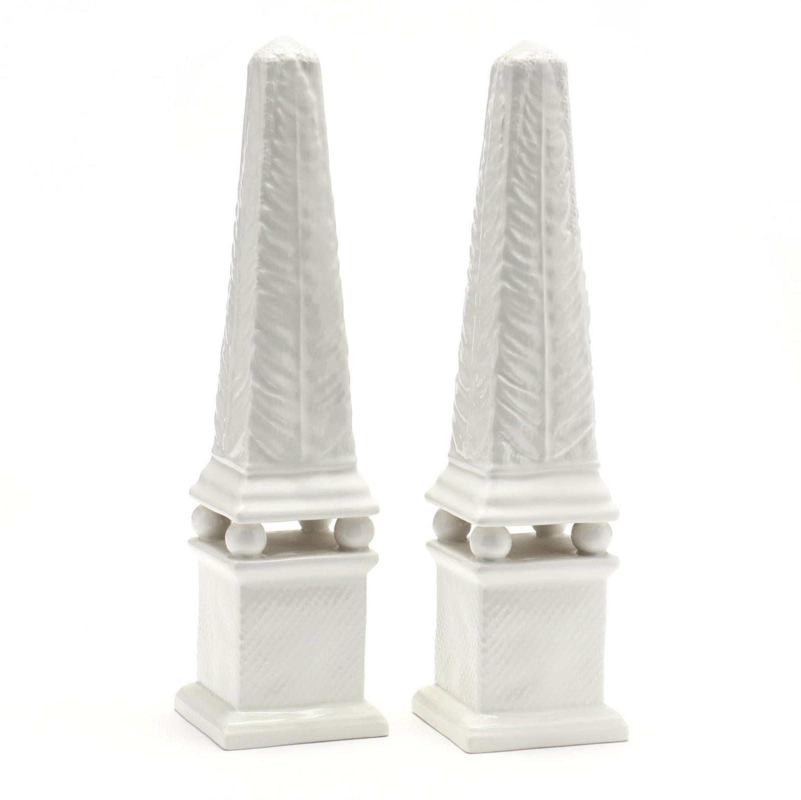 A Pair of Tiffany & Co. Porcelain Obelisks: A Pair of Tiffany & Co. Porcelain Obelisksmade in Italy, molded sides feature a descending pattern of leaves, marked on the underside interior. 12.75 in. The Collection of Mr. Duggins and Mr. Dunn, Hi