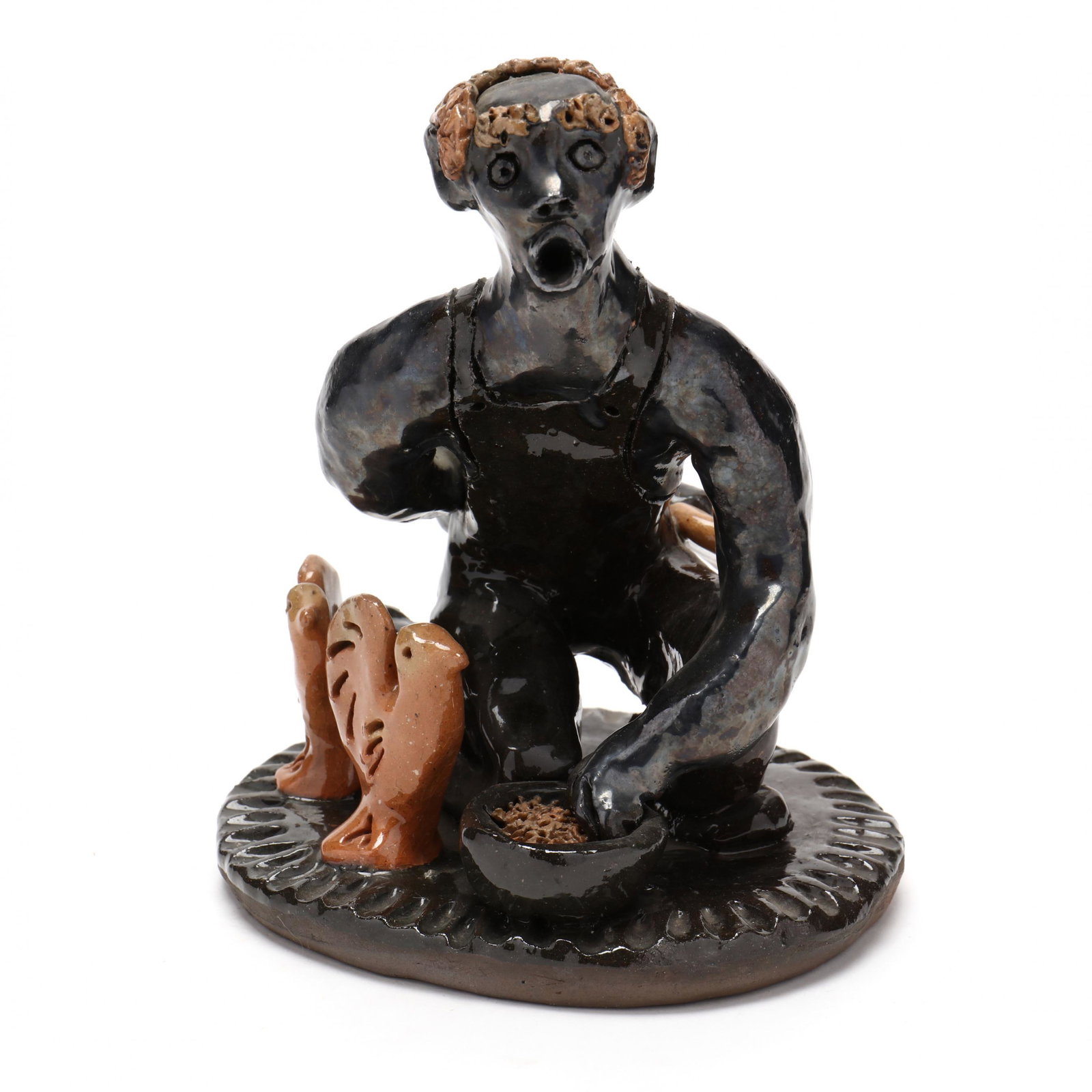 NC Folk Pottery, Billy Ray Hussey, Man with Chickens: NC Folk Pottery, Billy Ray Hussey, Man with Chickens Described as "Chicken Dinner", dark metallic glazed earthenware with polychrome, circular decorated platform base, inscribed on the underside "BH 4